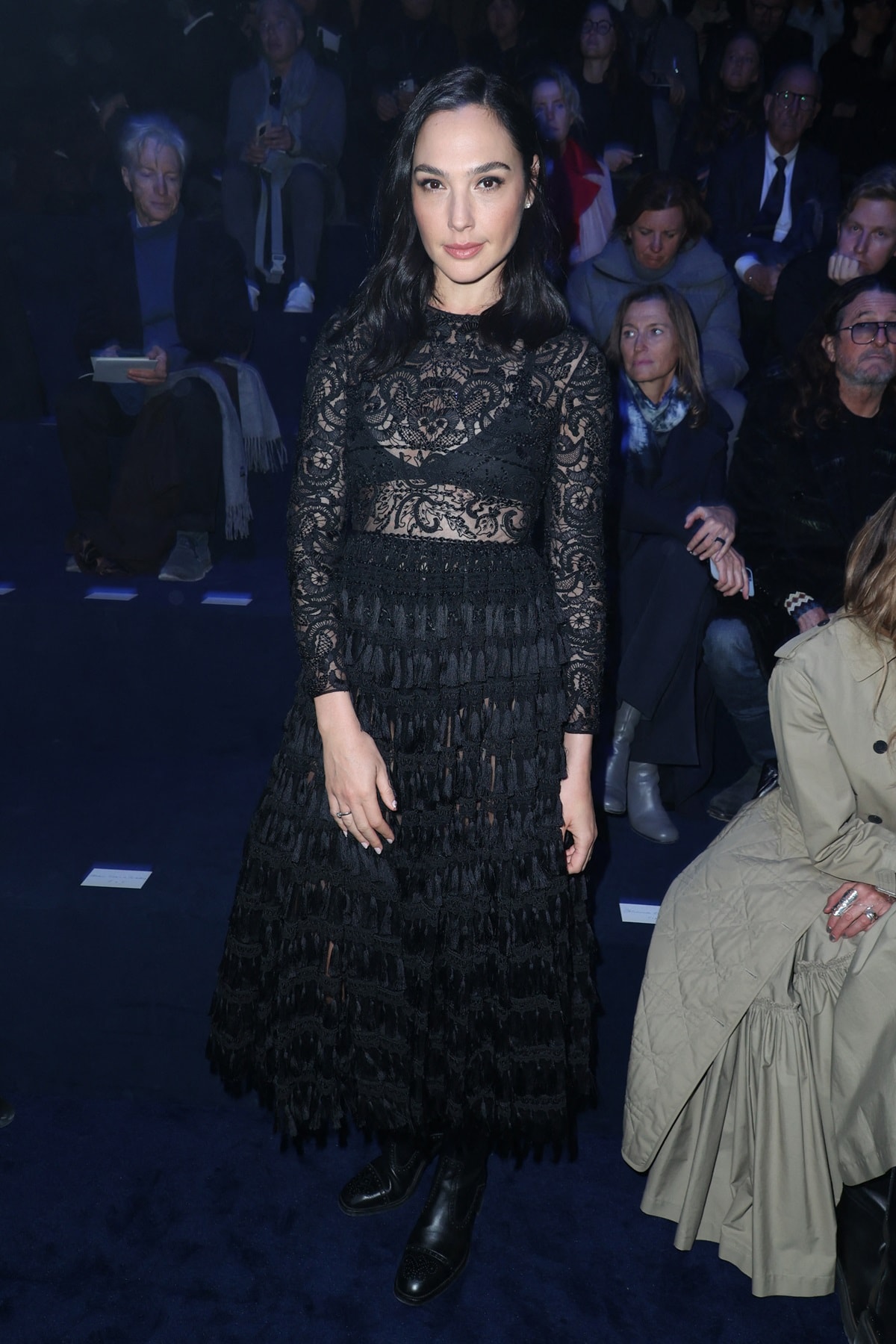 Gal Gadot donned an all-black ensemble, comprising a lace top with a mock neckline layered over a black bralette at the Christian Dior Fall 2023 Ready To Wear Runway Show