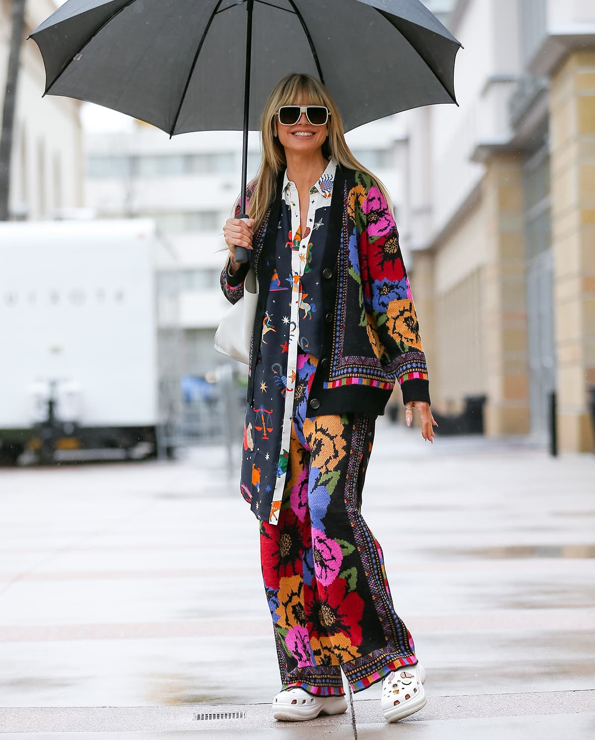 Heidi Klum embraces maximalism in a sustainable zodiac-print shirt dress and tapestry sweater pants and cardigan by Farm Rio