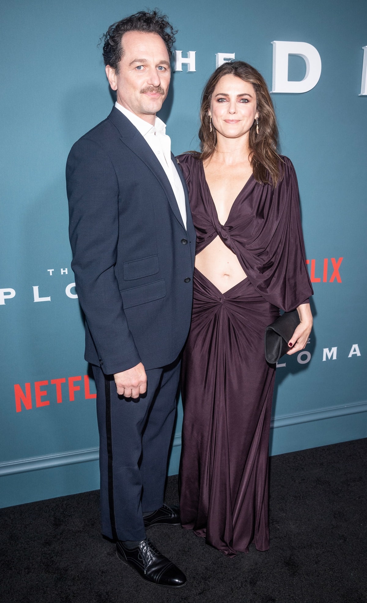 Matthew Rhys is taller than his wife, Keri Russell. Matthew Rhys stands at 5 feet 10.5 inches (179.1 cm) tall, while Keri Russell is 5 feet 4 inches (162.6 cm) tall
