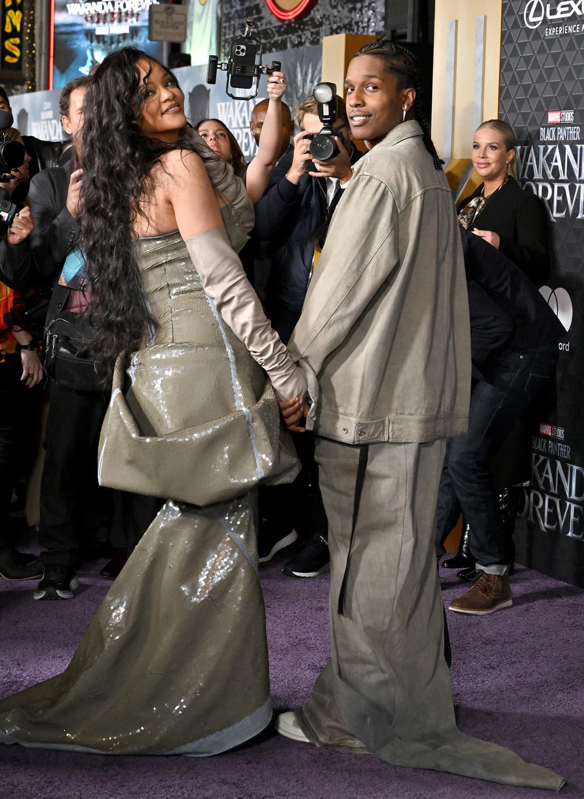 Rihanna, in an olive green Rick Owens dress paired with lengthy gloves, and A$AP Rocky, in an oversized khaki jacket and matching pants, attend Marvel Studios' "Black Panther: Wakanda Forever" premiere