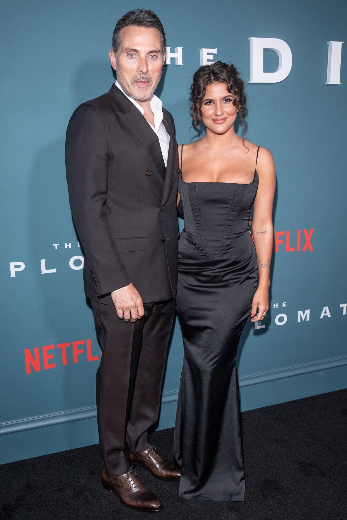 Posing with his girlfriend, Vivian Benitez, Rufus Sewell is an English actor, standing 6 feet (182.9 cm) tall and known for his roles in films like Dark City, The Illusionist, Gods of Egypt, and the TV series The Man in the High Castle