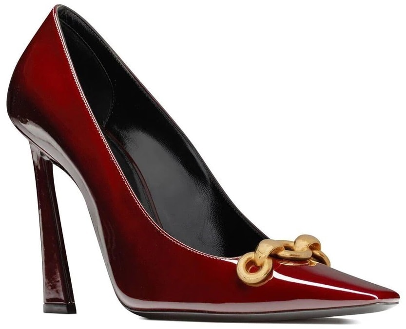 The Silvana pumps by Saint Laurent come in bordeaux patent leather with a metal chain link and a thick, curved heel