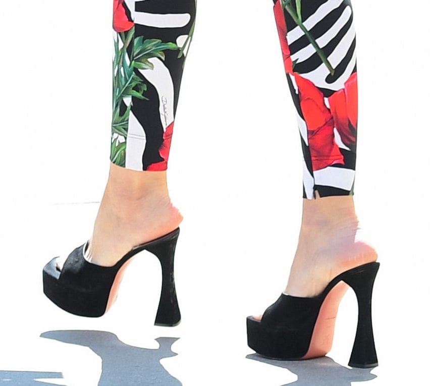 Sofia Vergara pairs her zebra, floral-printed leggings with Amina Muaddi black suede mules