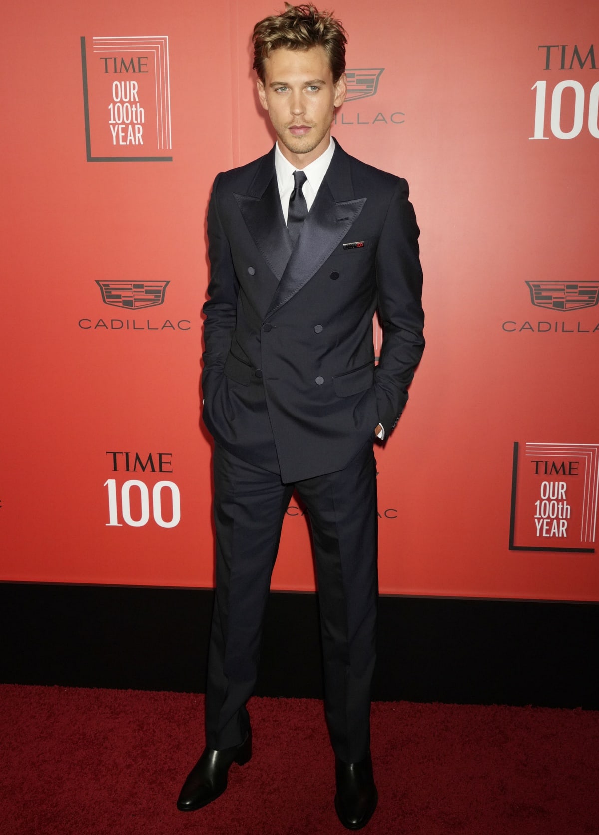 Ever the dapper gentleman, Austin Butler wore a classic black suit with black leather boots