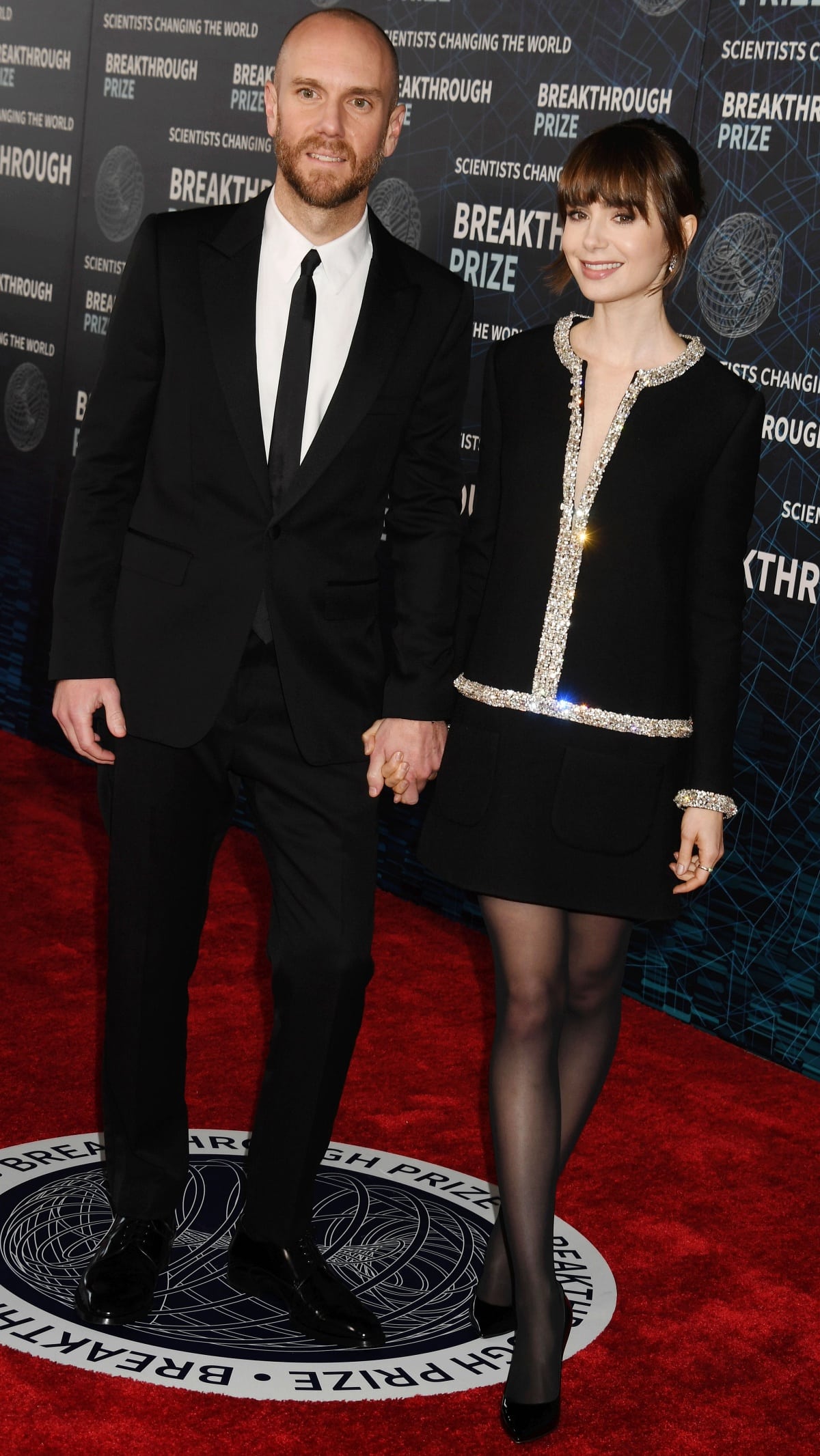 Charlie McDowell and Lily Collins in matching Celine looks at the 9th Annual Breakthrough Prize Ceremony