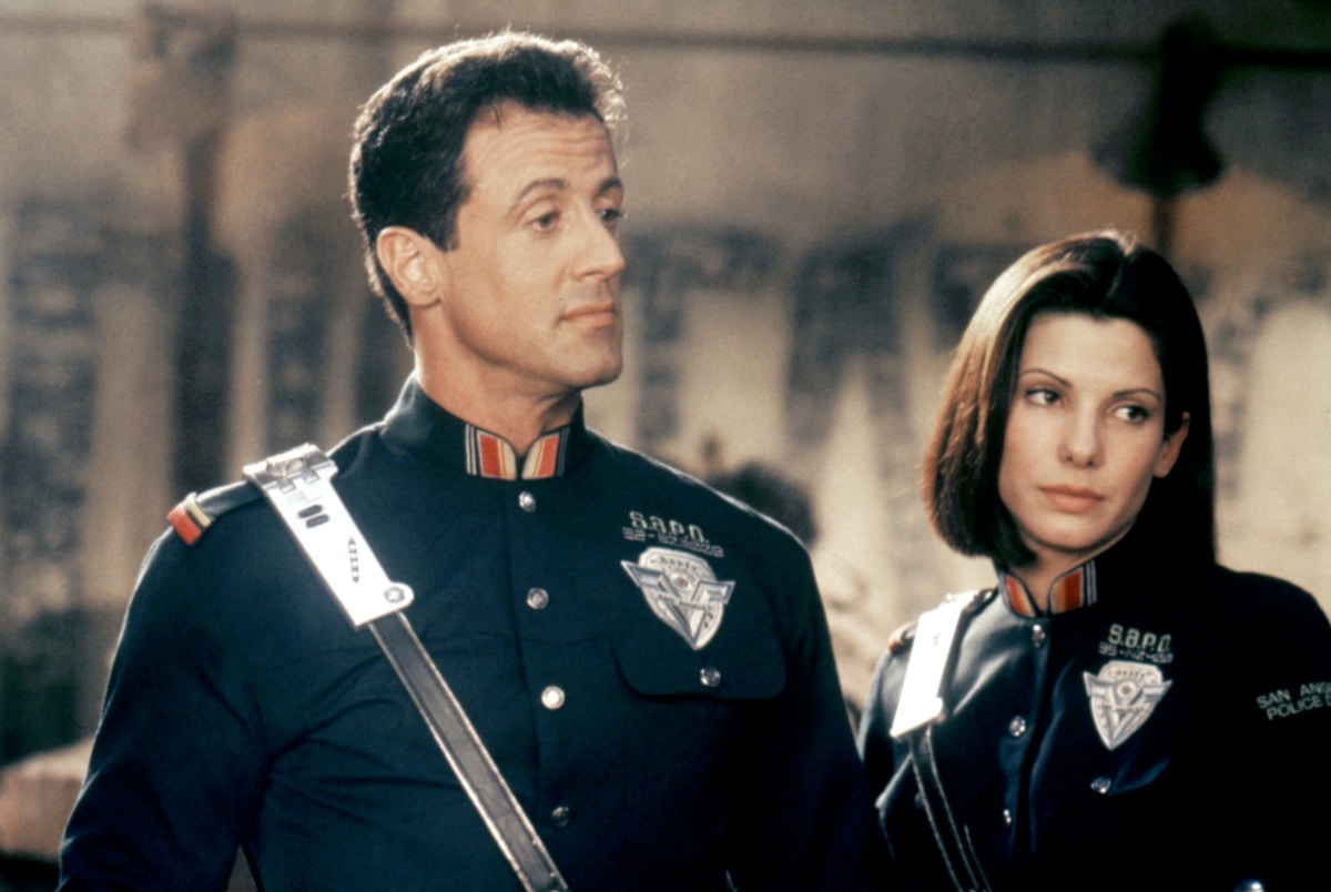 Sylvester Stallone as John Spartan and Sandra Bullock as Lt. Lenina Huxley in the 1993 science fiction action film Demolition Man