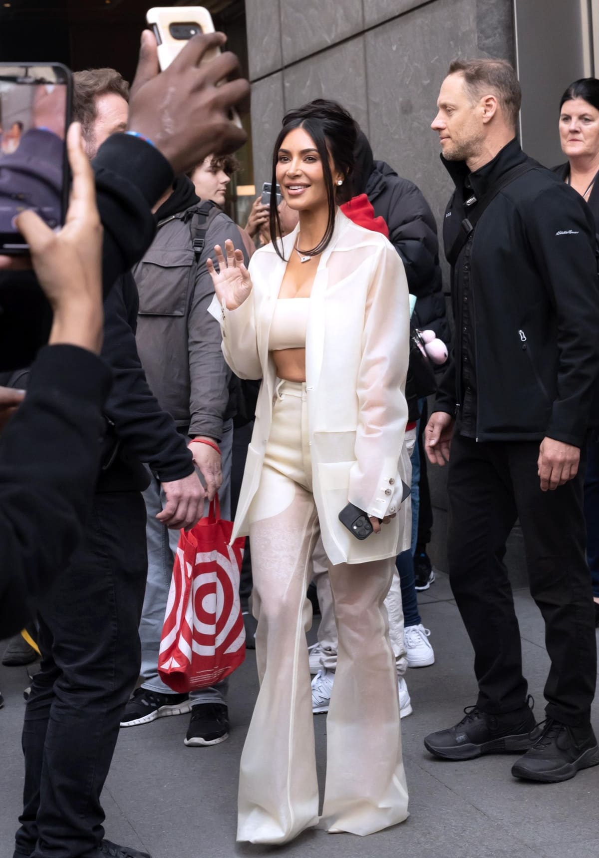 Kim Kardashian posing for photographs as she exits the Time100 Summit