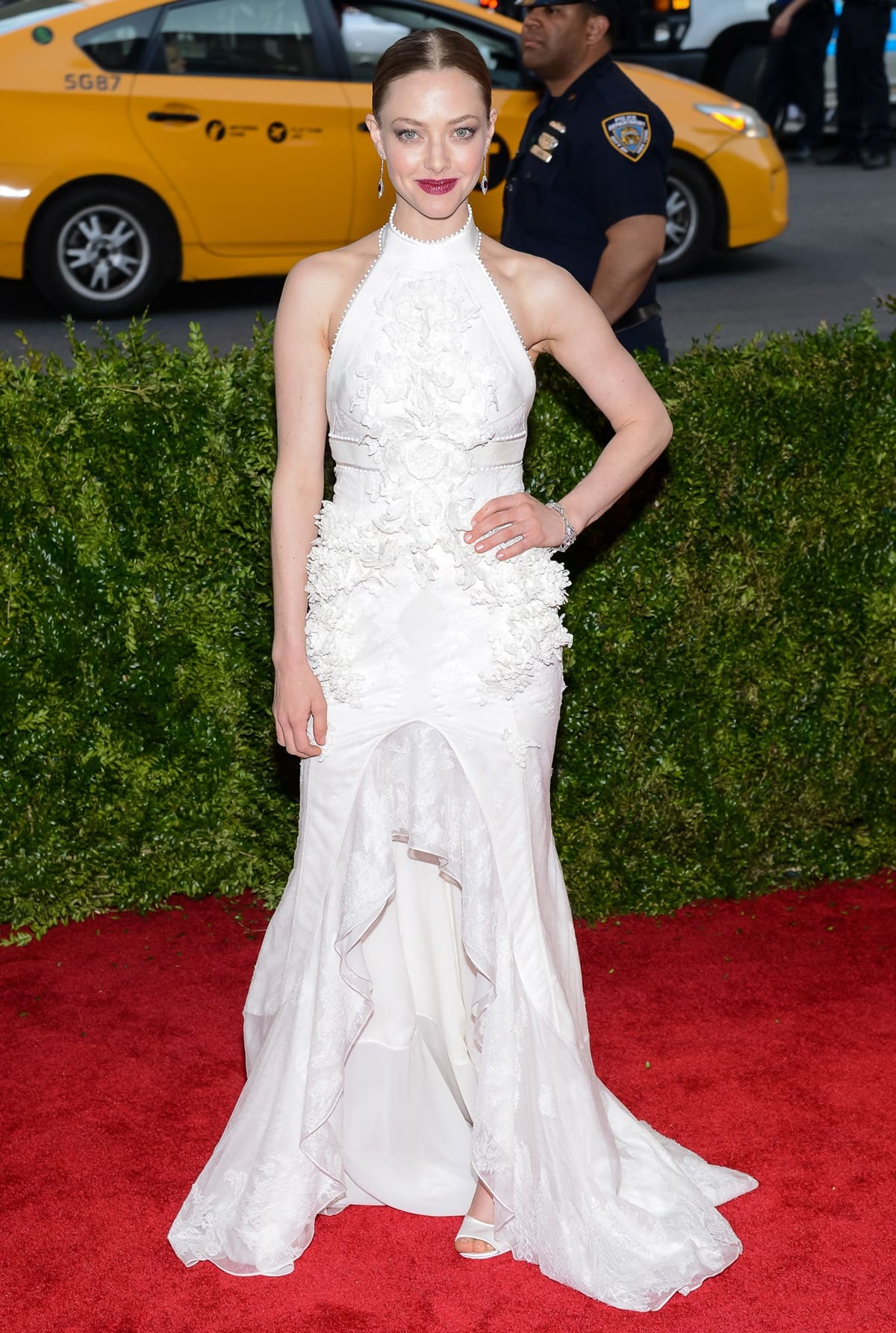 Amanda Seyfried graced the 2015 Met Gala red carpet in a stunning white Givenchy Couture halter-neck dress at the 'China: Through The Looking Glass' Costume Institute Benefit Gala at the Metropolitan Museum of Art
