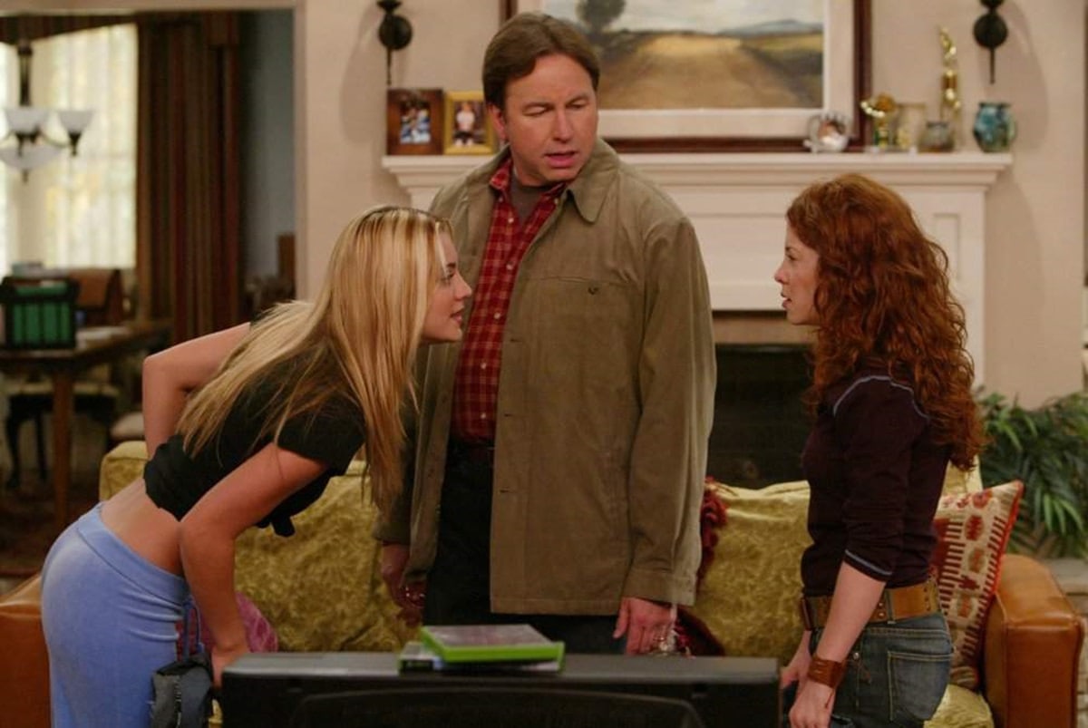 John Ritter portrayed Paul Hennessy, the father of Bridget, Kerry, and Rory, in the sitcom "8 Simple Rules ... for Dating My Teenage Daughter," with Kaley Cuoco as Bridget and Amy Davidson as Kerry