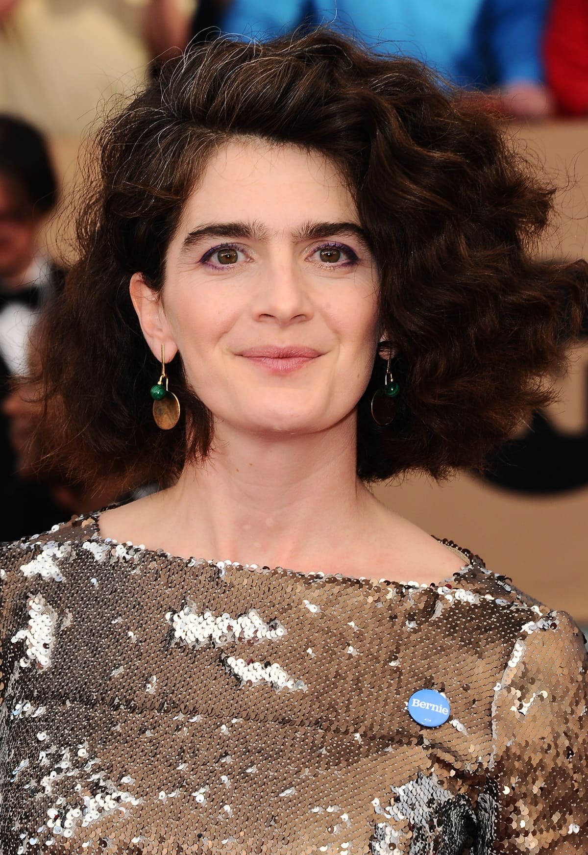 Gaby Hoffmann, who played the youngest daughter of Bob and Cindy Russell in Uncle Buck, in a stunning sequined Rachel Comey dress with a small blue Bernie Sanders pin at the 22nd Annual Screen Actors Guild Awards