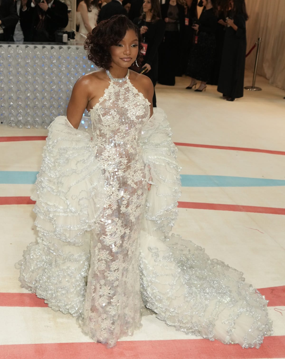 The intricate ruffles on Halle Bailey's cape resembled the tendrils of a frilly jellyfish, making the outfit even more captivating