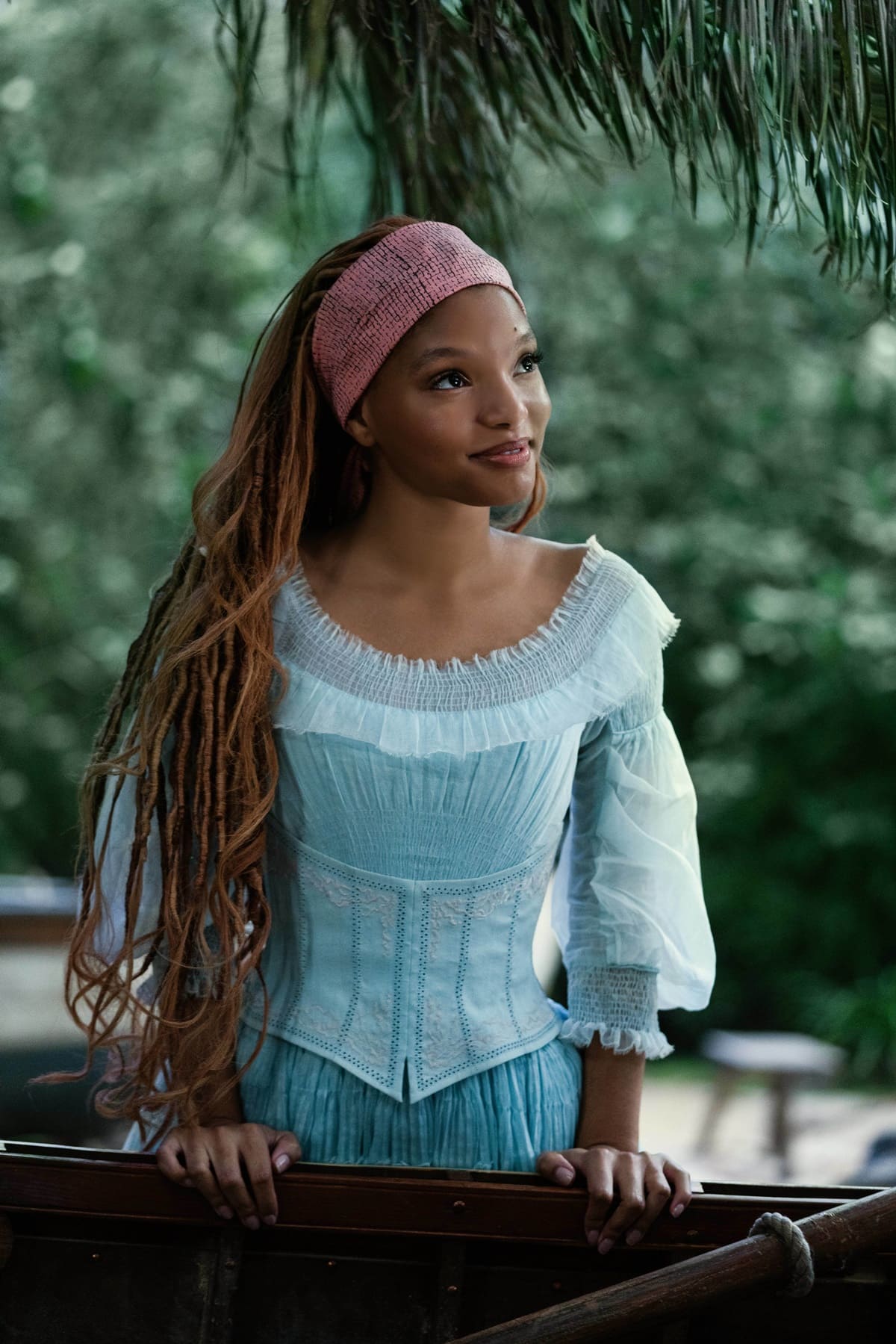 Halle Bailey humorously mentioned that she almost broke her neck while recreating the famous 'hair flip' scene from "The Little Mermaid" due to the heavy weight of her wig