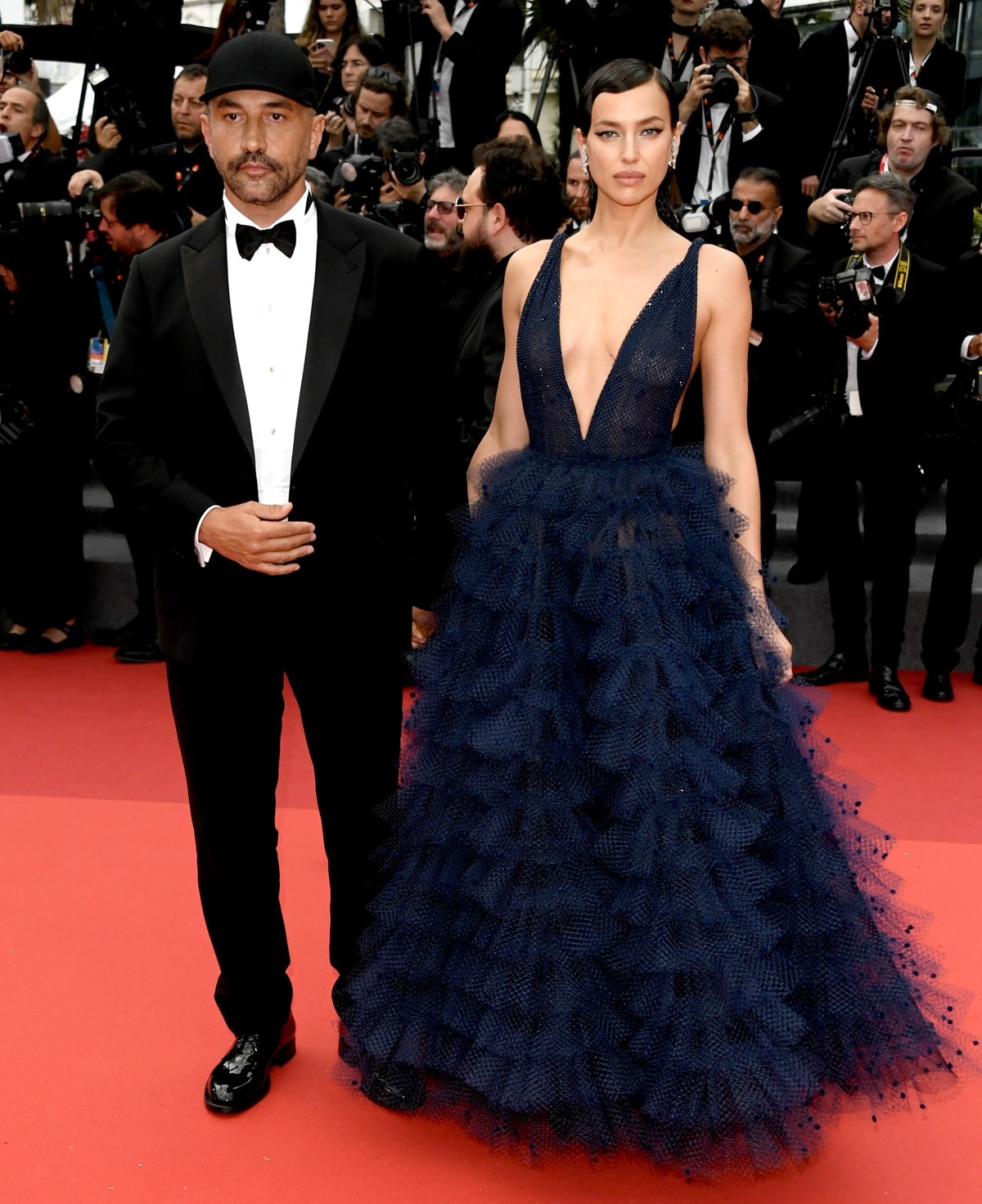 Russian model Irina Shayk and fashion designer Riccardo Tisci attend the "Killers Of The Flower Moon" red carpet during the 76th annual Cannes film festival