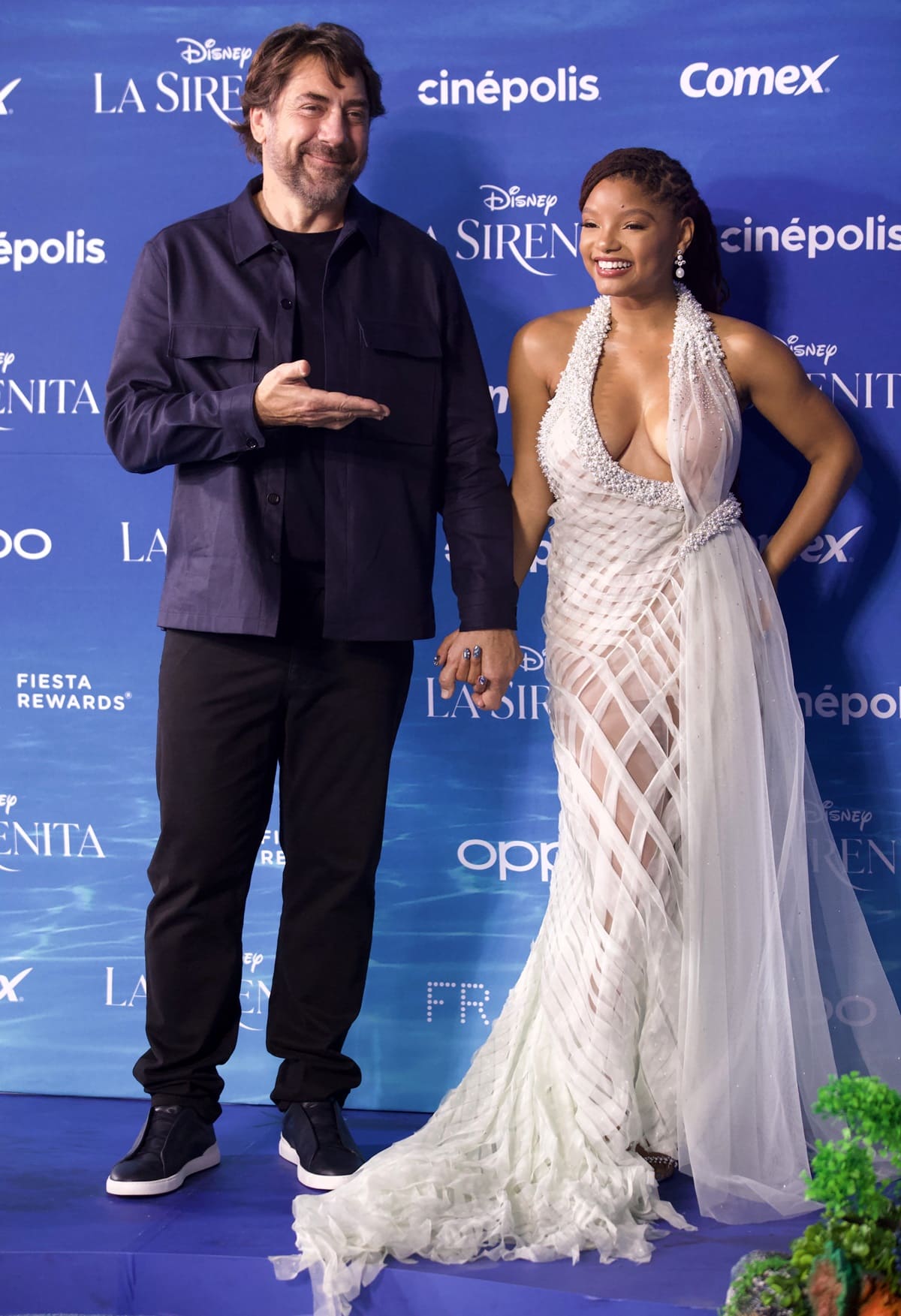 Javier Bardem, who plays King Triton, and Halle Bailey pose during the fan event for the Premiere of Disney's "The Little Mermaid"
