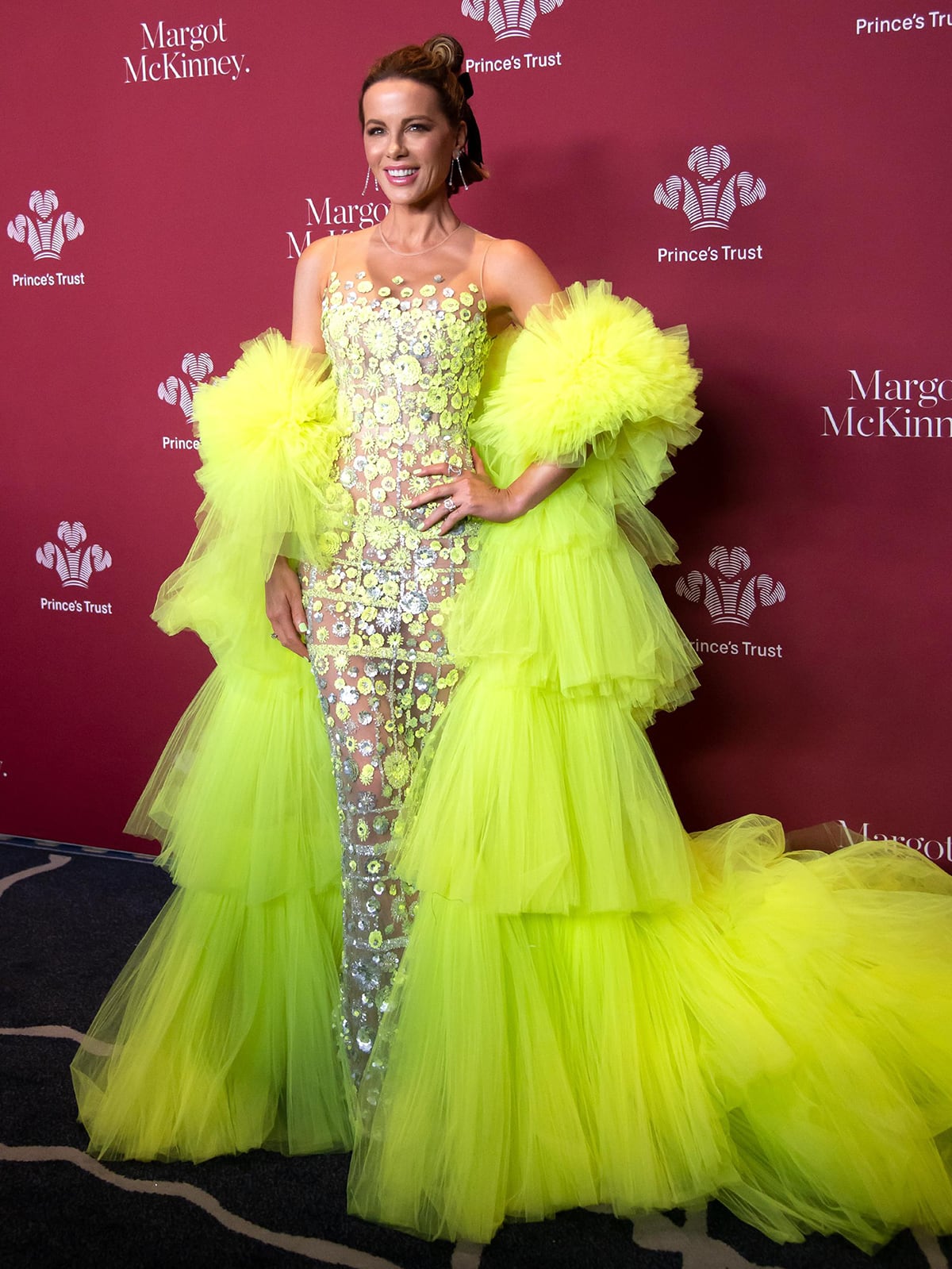 Kate Beckinsale attends the 2023 Prince's Trust Global Gala in a bizarre see-through sheer gown with tiered, ruffled lime green cape sleeves on April 27, 2023