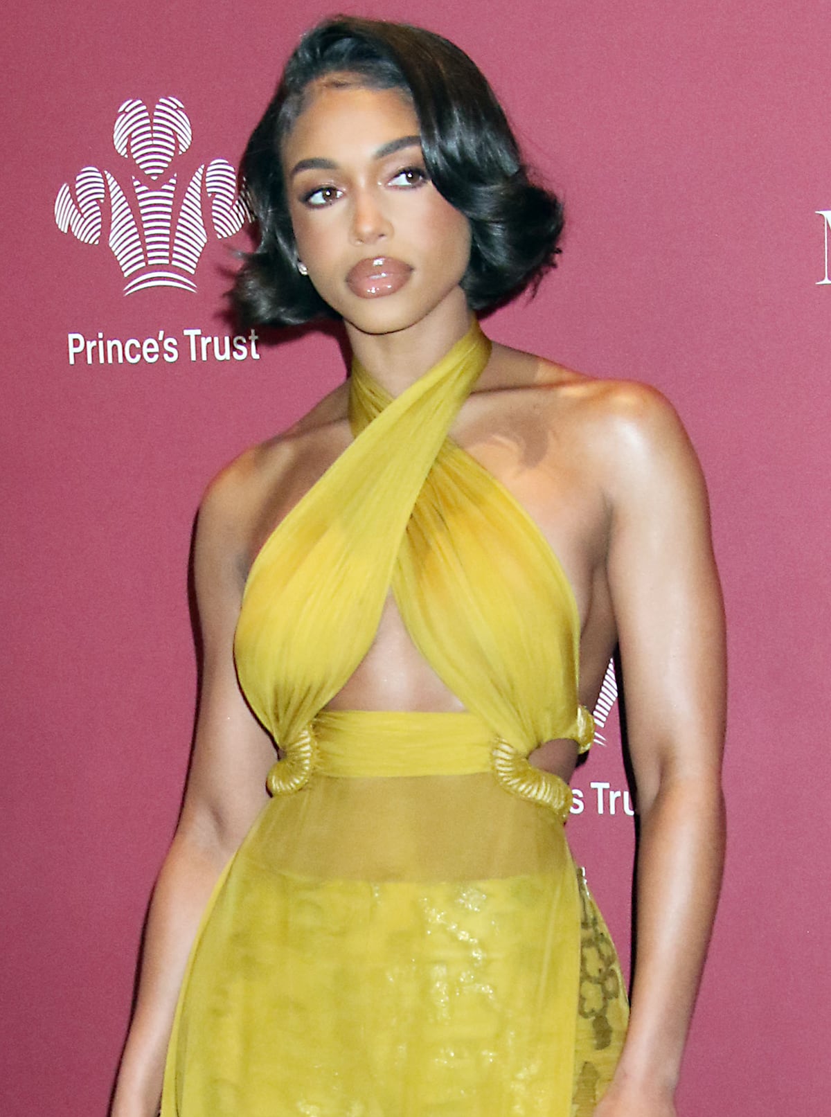 Lori Harvey styles her hair in old Hollywood curled bob and glams up with glossy nude lipstick and rosy cheeks