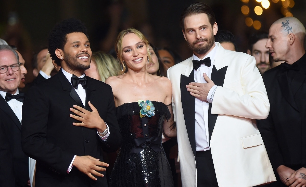 Abel Tesfaye, Lily-Rose Depp, and Sam Levinson celebrating the premiere of The Idol during the 76th Cannes Film Festival