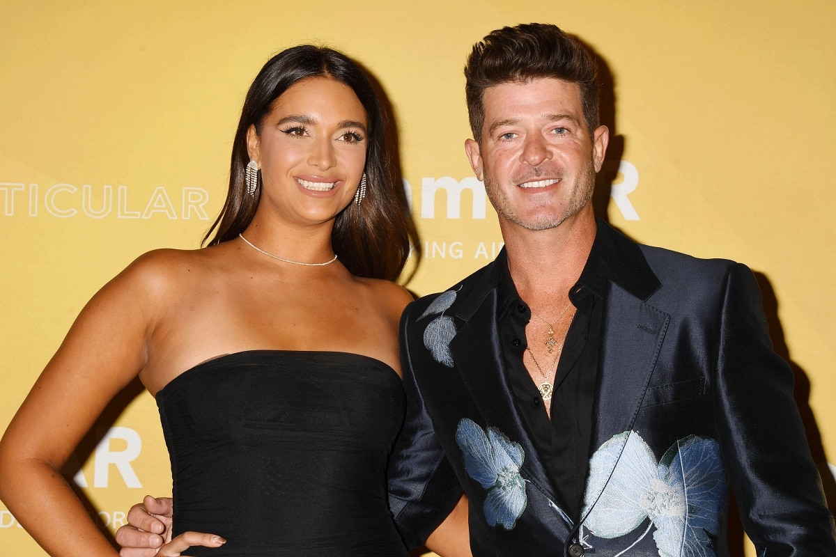 April Love Geary and Robin Thicke making an appearance at the 2022 amfAR Los Angeles Gala