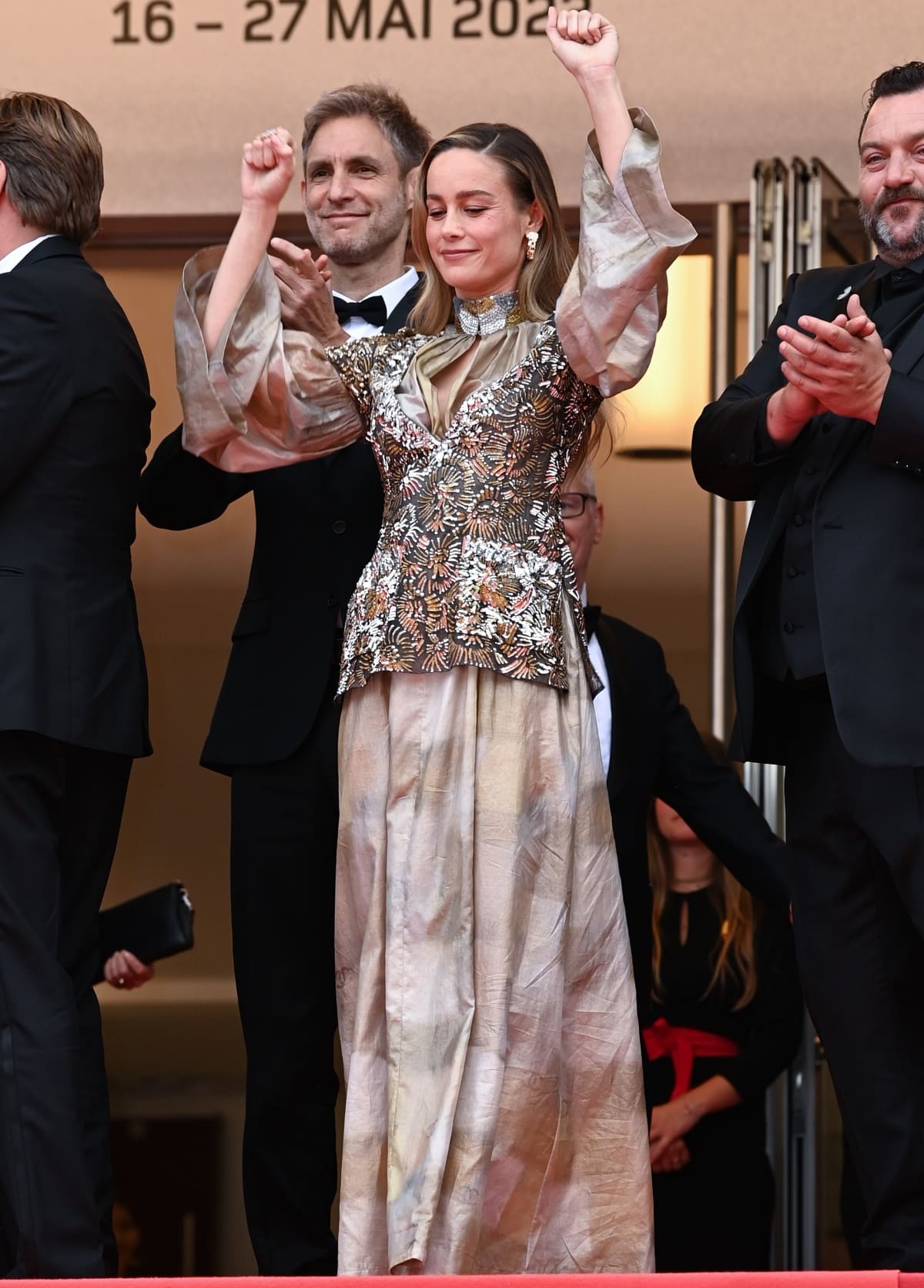 Brie Larson celebrating during opening night of the 76th Cannes Film Festival