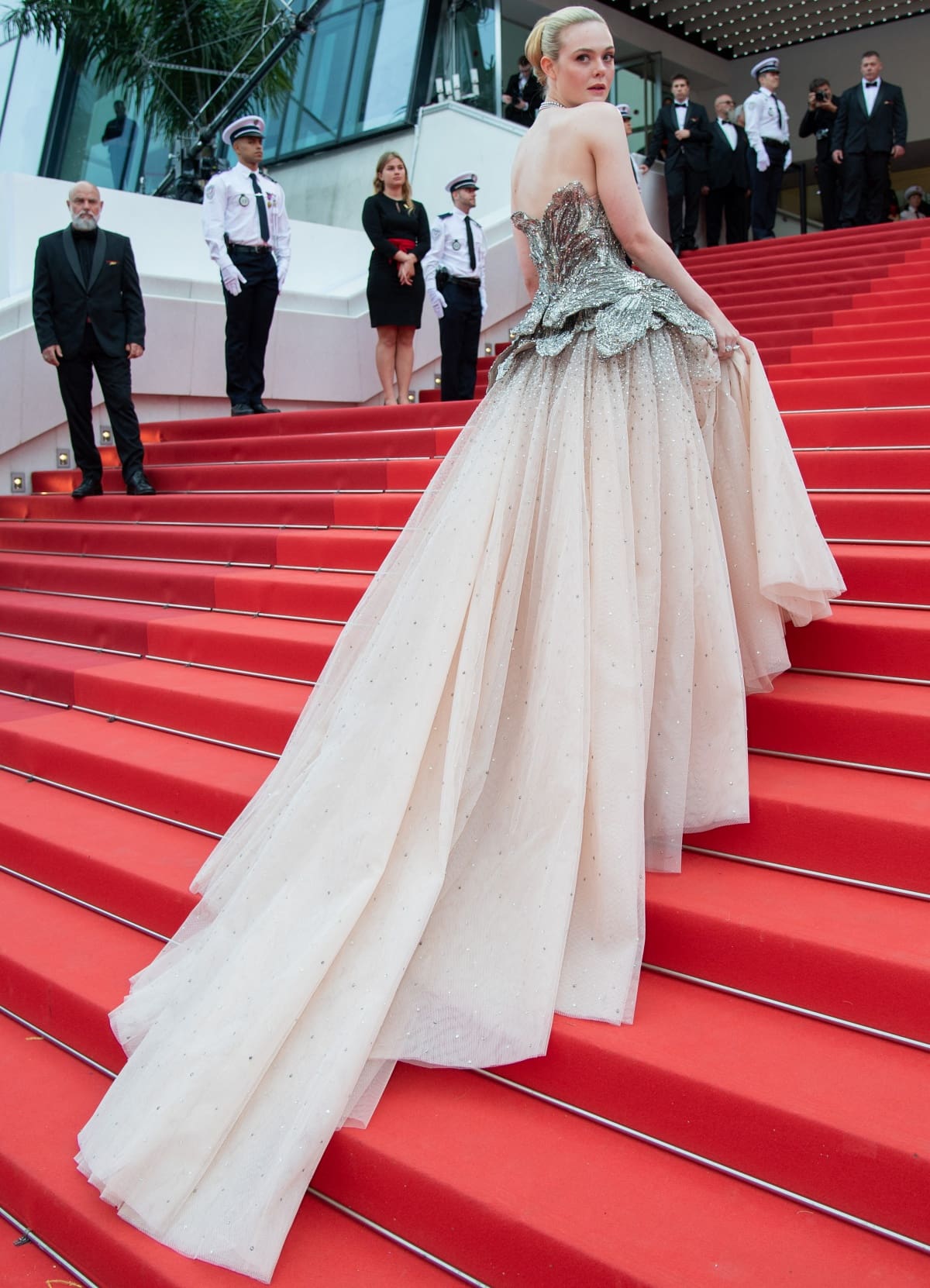 The Alexander McQueen gown’s tulle train trailed behind Elle Fanning as she went up the iconic steps at this year’s Cannes Film Festival