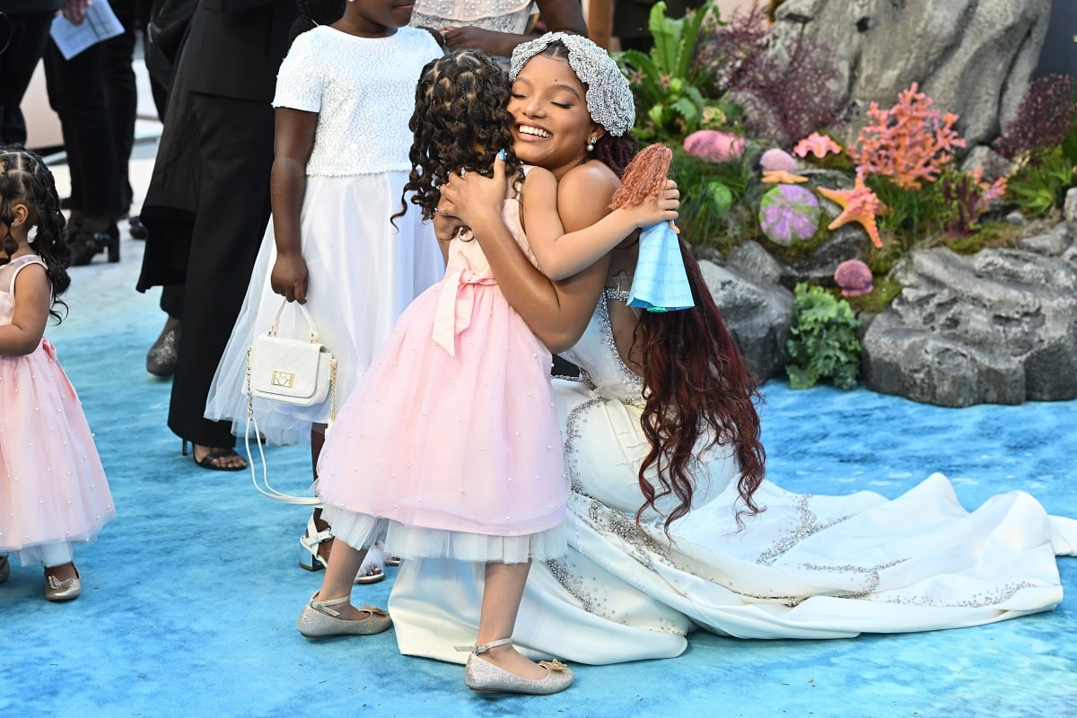 Halle Bailey interacting with little kids and making an impact as Ariel in The Little Mermaid at the UK premiere of the film