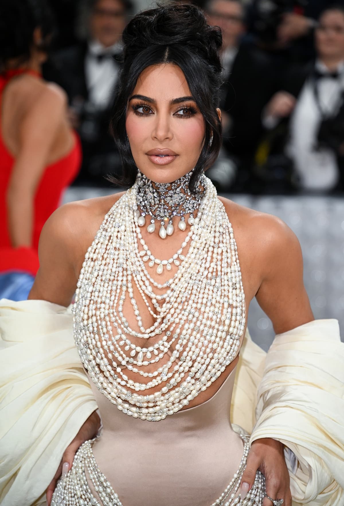 Kim Kardashian swept her hair up in a dramatic updo to effectively show off her diamonds, pearls, and crystals
