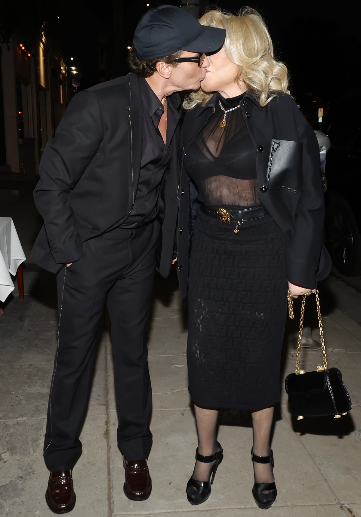 Lloyd Klein and Jocelyn Wildenstein share a kiss as they hold an official engagement dinner with friends at Casablanca Moroccan Kitchen in Los Angeles