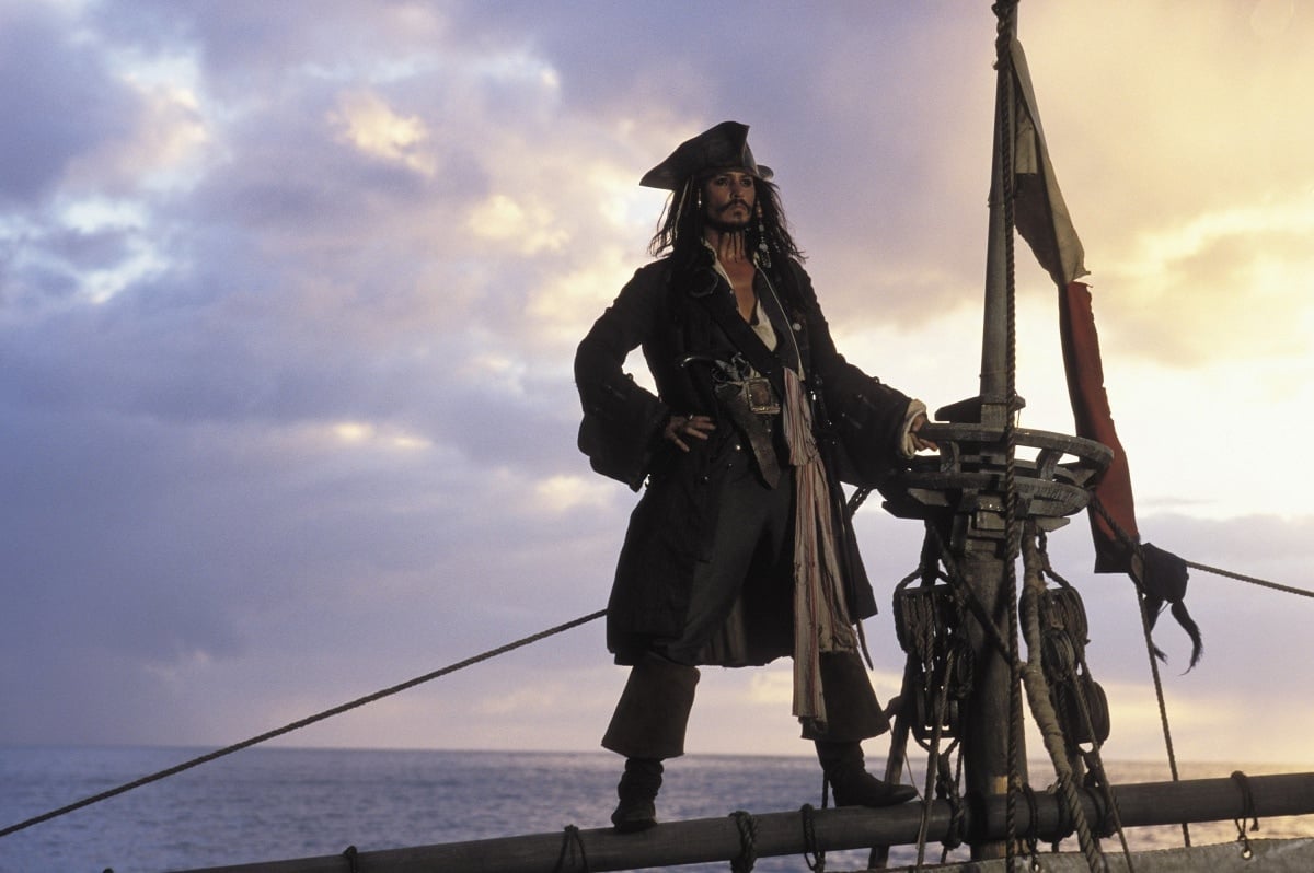 Johnny Depp's iconic portrayal of Captain Jack Sparrow in the 2003 supernatural swashbuckler film Pirates of the Caribbean: The Curse of the Black Pearl was nothing short of legendary, as he brought the eccentric and charismatic pirate to life with his impeccable comedic timing, quirky mannerisms, and captivating charm, forever etching the character into pop culture history
