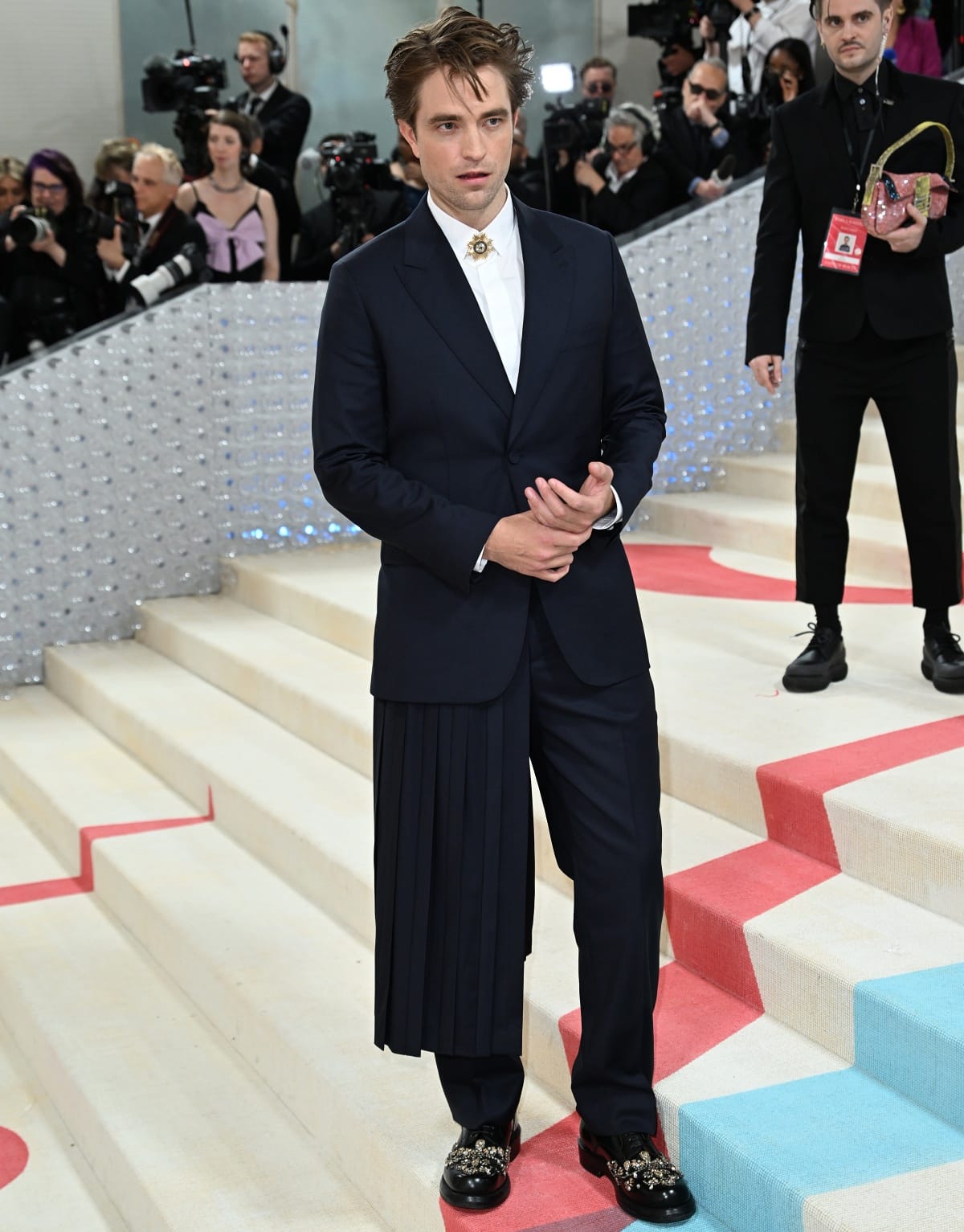 Robert Pattinson stepped out in a Dior suit styled with a brooch and bejeweled dress shoes