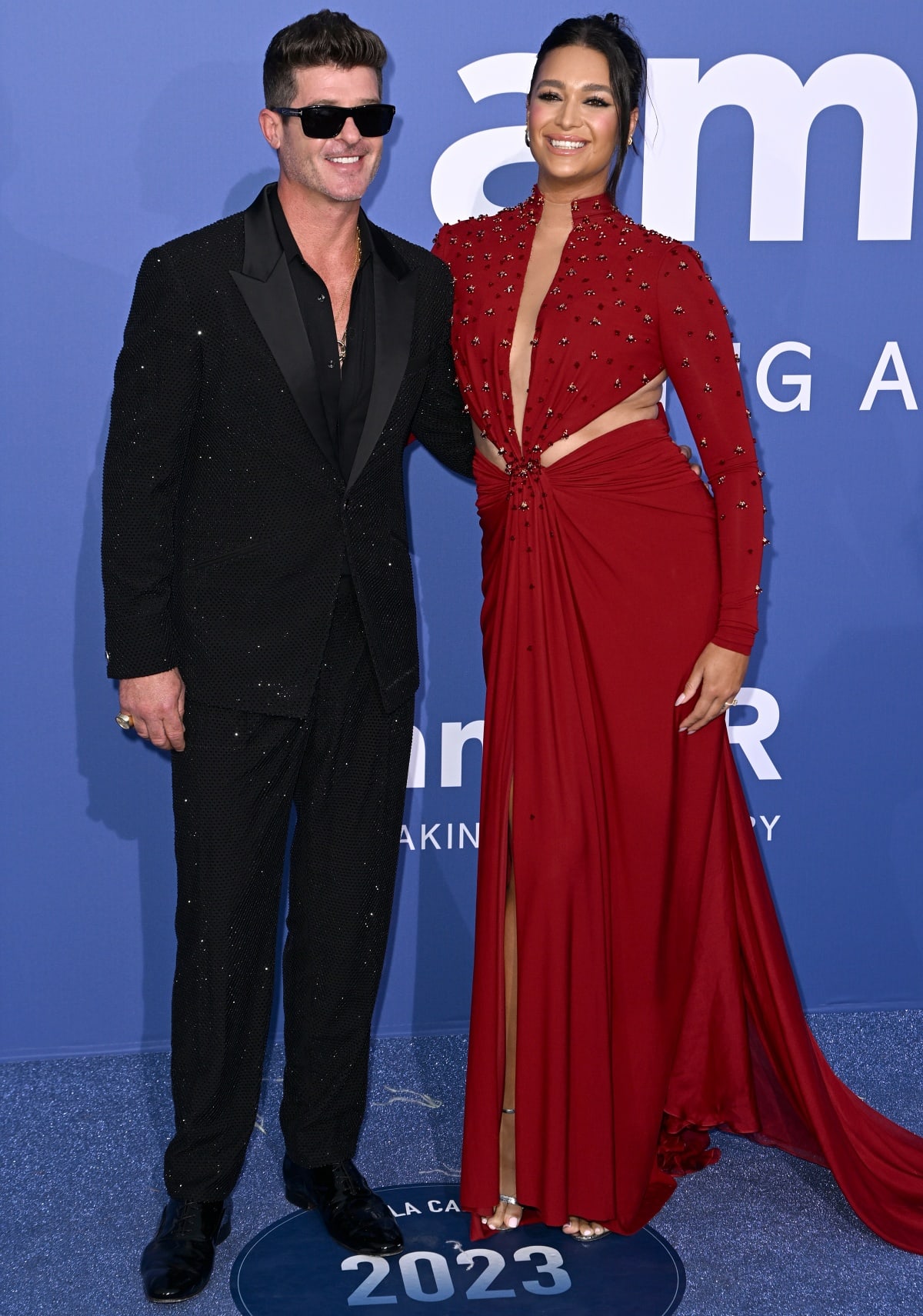 Robin Thicke and April Love Geary attending the amfAR Gala during the 76th Cannes Film Festival