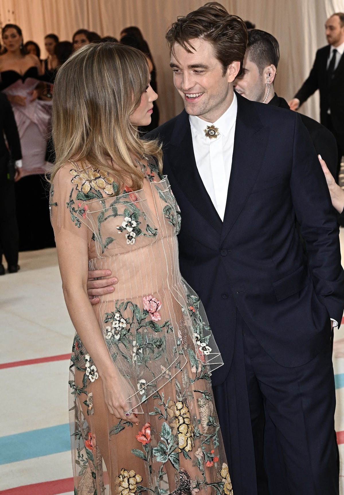 Suki Waterhouse and Robert Pattinson cozied up to each other on a rare red carpet appearance at the 2023 Met Gala