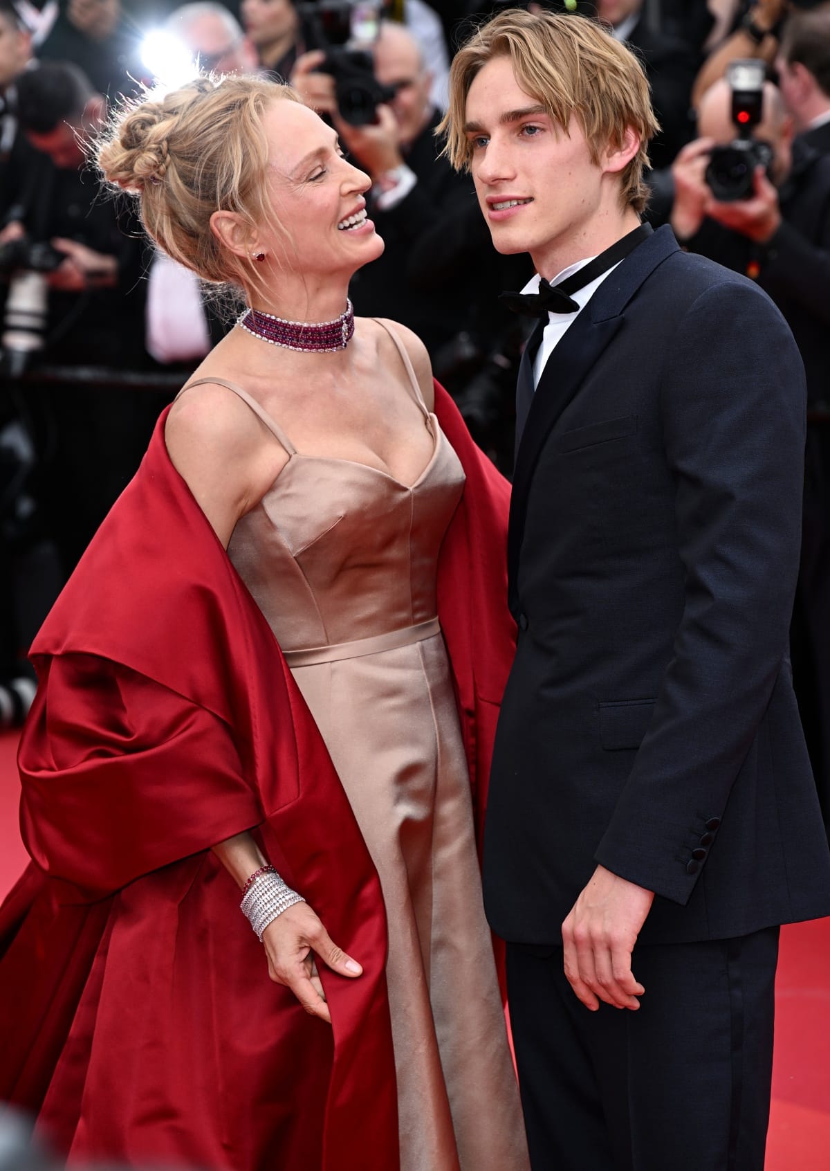 Uma Thurman looking proudly at son Levon Hawke, who looked dashing in his classic tuxedo with a sleek bowtie