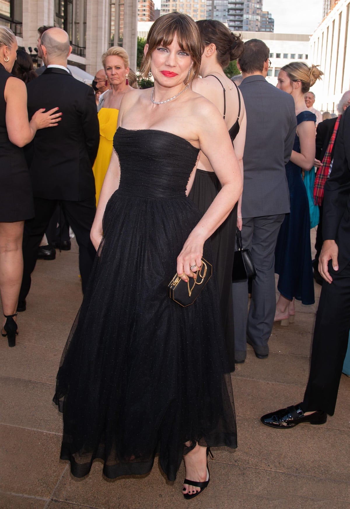 Anna Chlumsky stuns in a strapless black gown paired with sleek black heels and a chic clutch