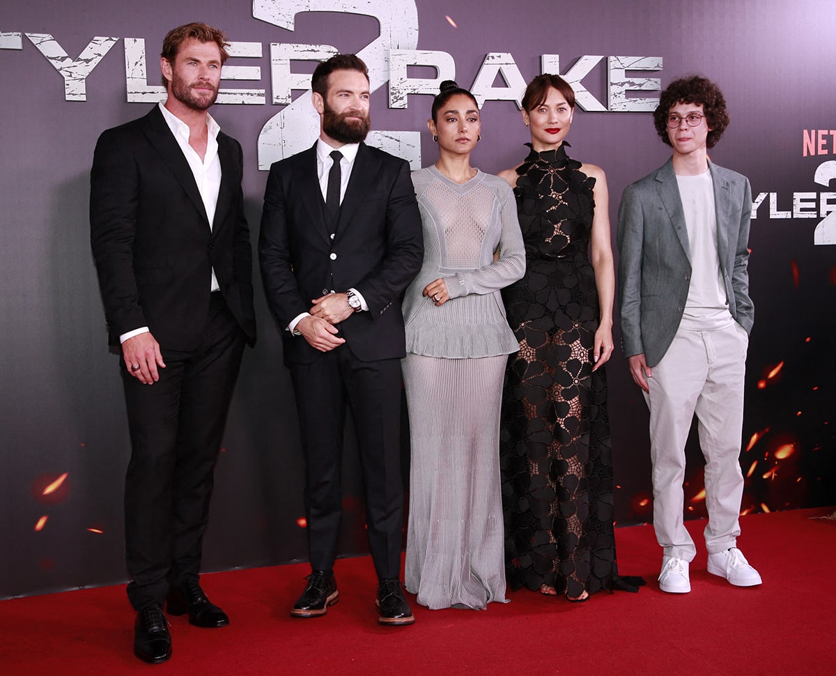 Chris Hemsworth is joined by Extraction 2 director Sam Hargrave and co-stars Golshifteh Farahani and Olga Kurylenko on the red carpet