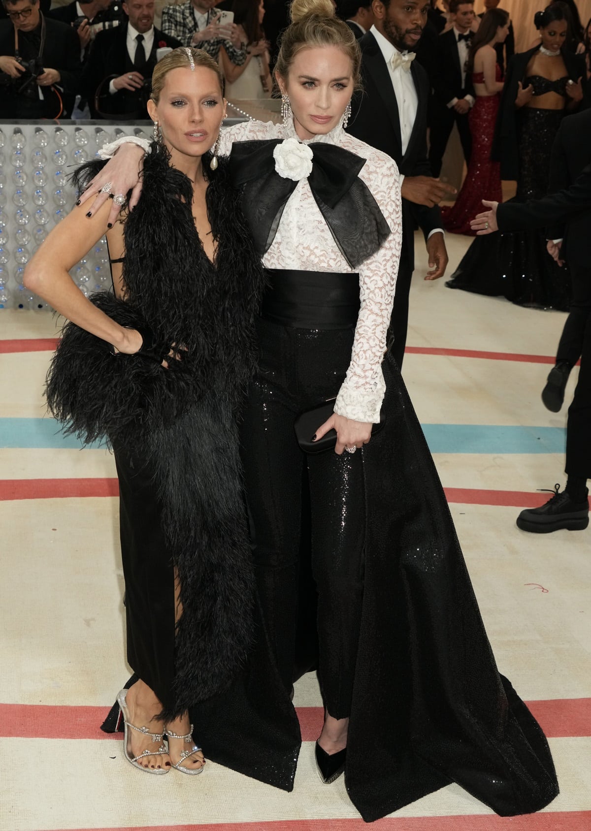 At the 2023 Met Gala in New York City, Emily Blunt stood taller than Sienna Miller, with a height of 5 feet 6 ½ inches (168.9 cm), compared to Sienna Miller's 5 feet 5 inches (165.1 cm), resulting in a 1 ½ inch (3.8 cm) difference between them, as they celebrated 