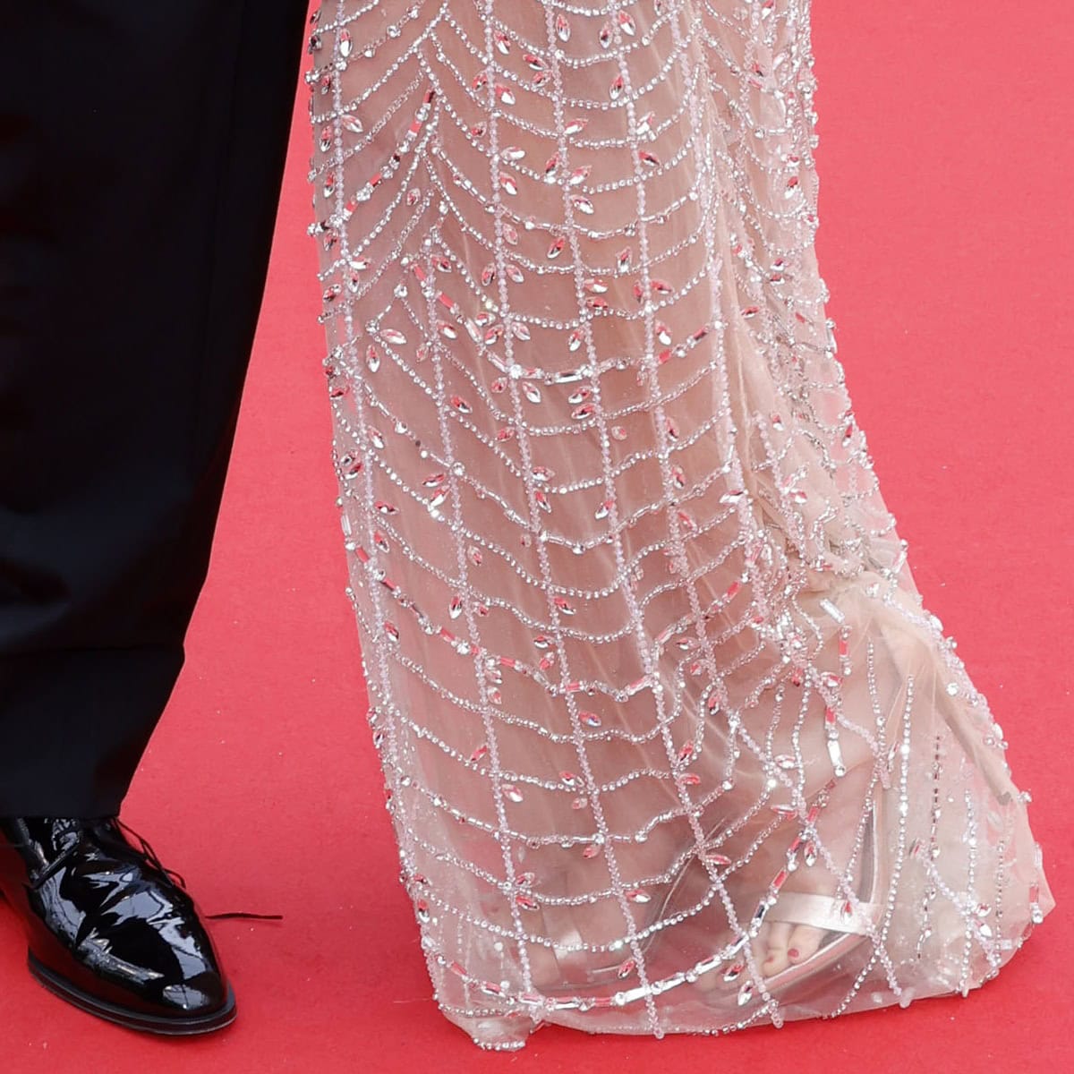 Daniella Pick elevated her red carpet look with silver platform stiletto sandals that elongated her statuesque frame, perfectly showcasing her polished red pedicure