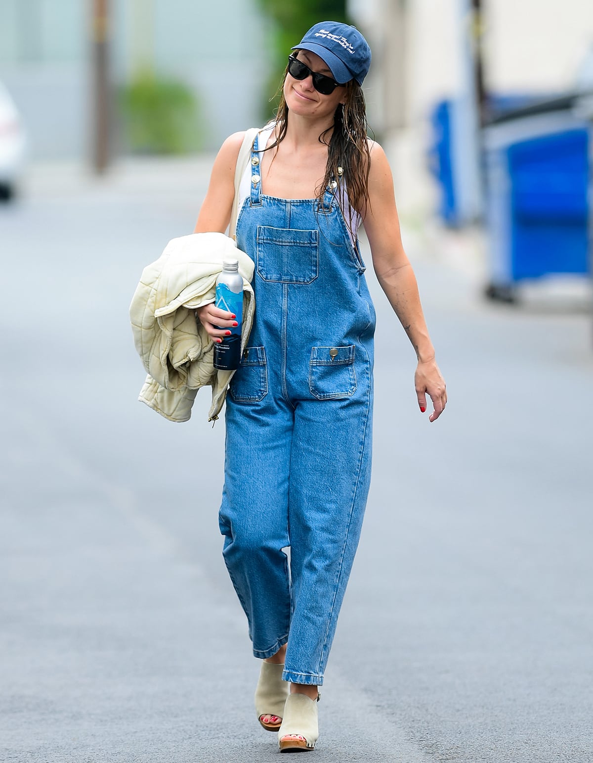 Olivia Wilde leaving the gym in a denim jumpsuit by Sezane and a white tank top by La Ligne on June 8, 2023