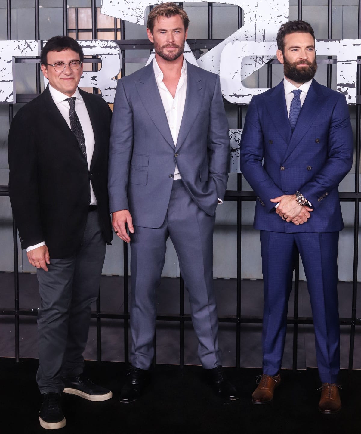 Producer Anthony Russo, Chris Hemsworth, and director Sam Hargrave looking dapper in their suits