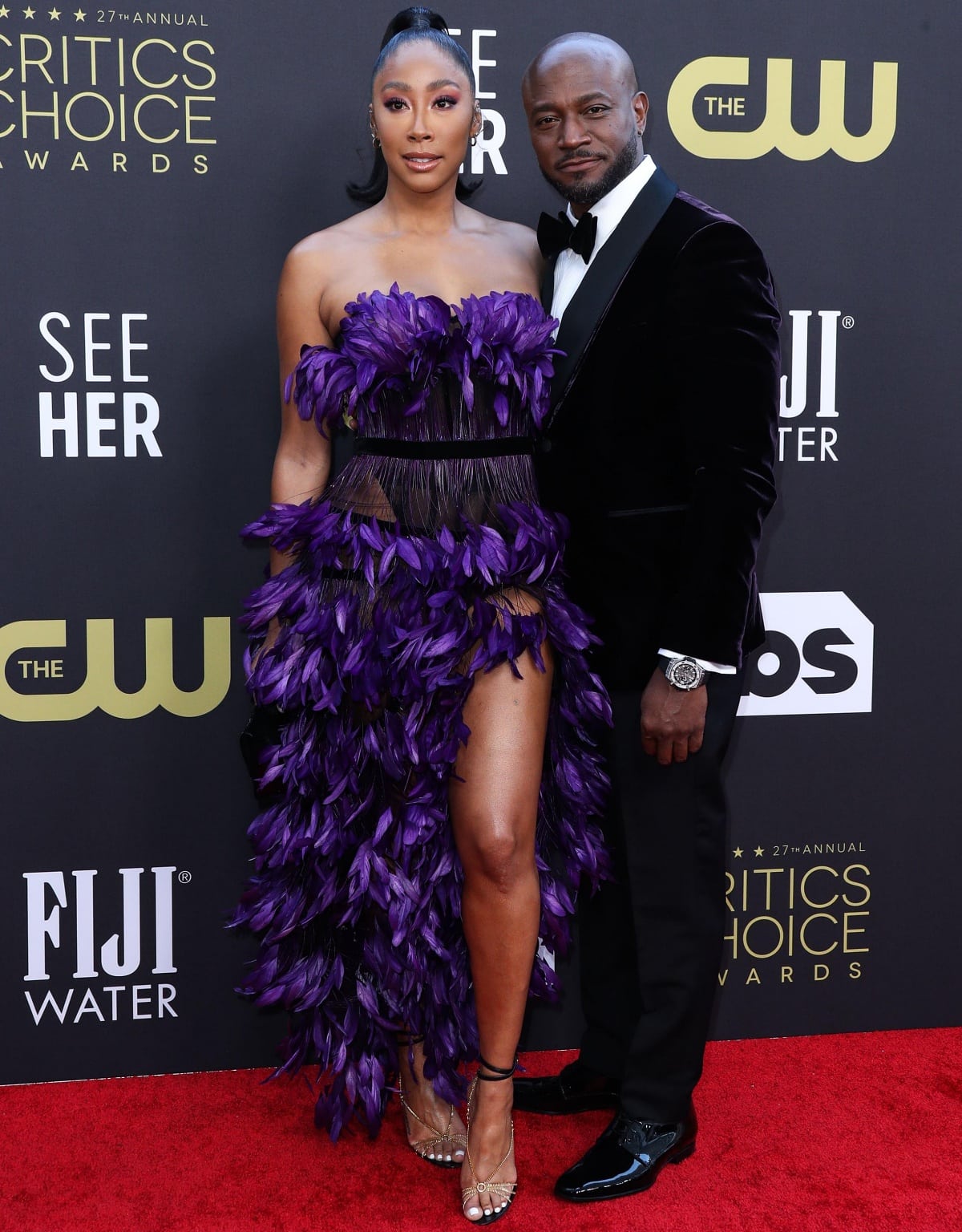 Apryl Jones in high heels appearing taller than Taye Diggs in glossy black dress shoes at the 27th Annual Critics Choice Awards