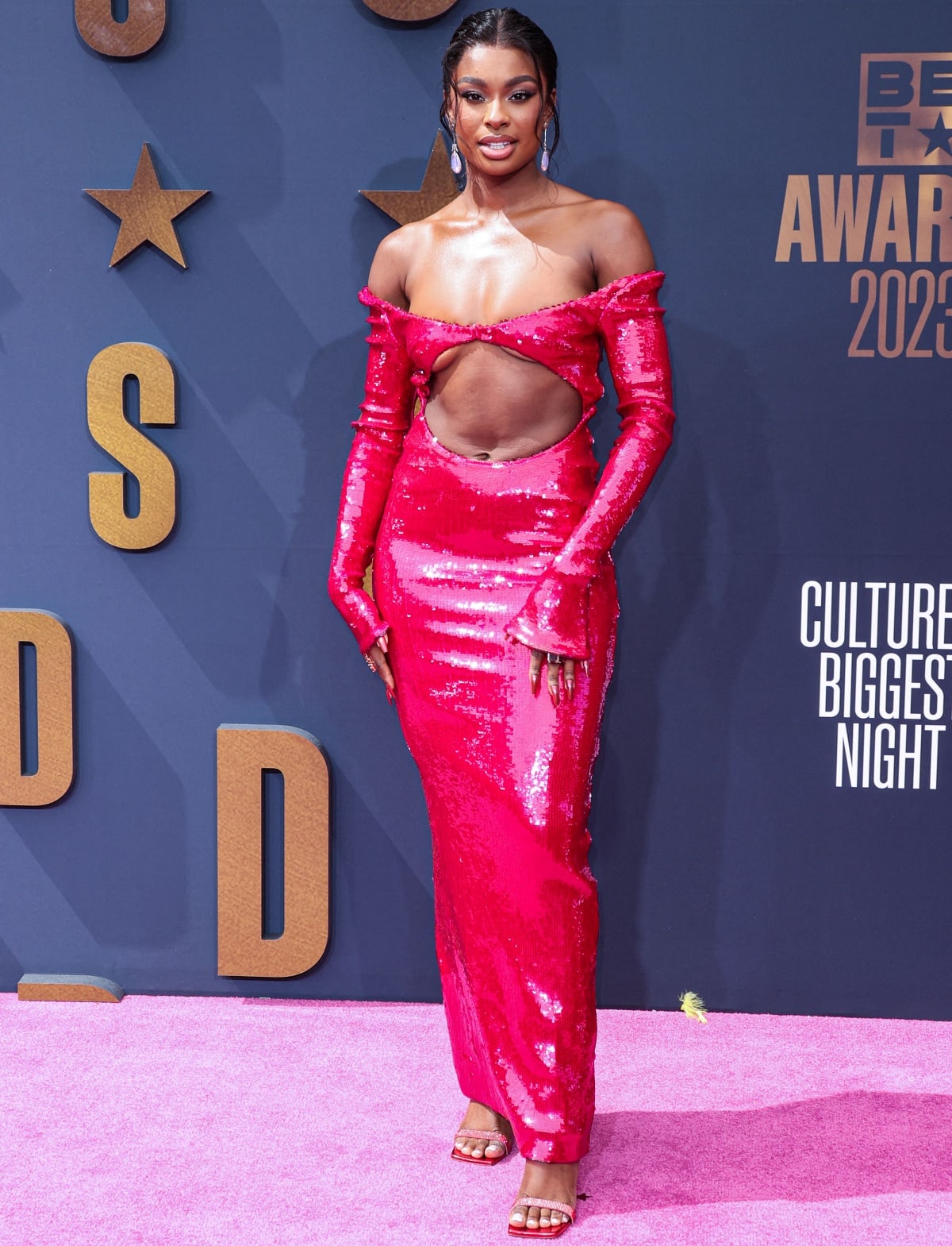 Coco Jones wearing a daring scarlet gown from LaQuan Smith’s Spring 2023 collection at the 2023 BET Awards