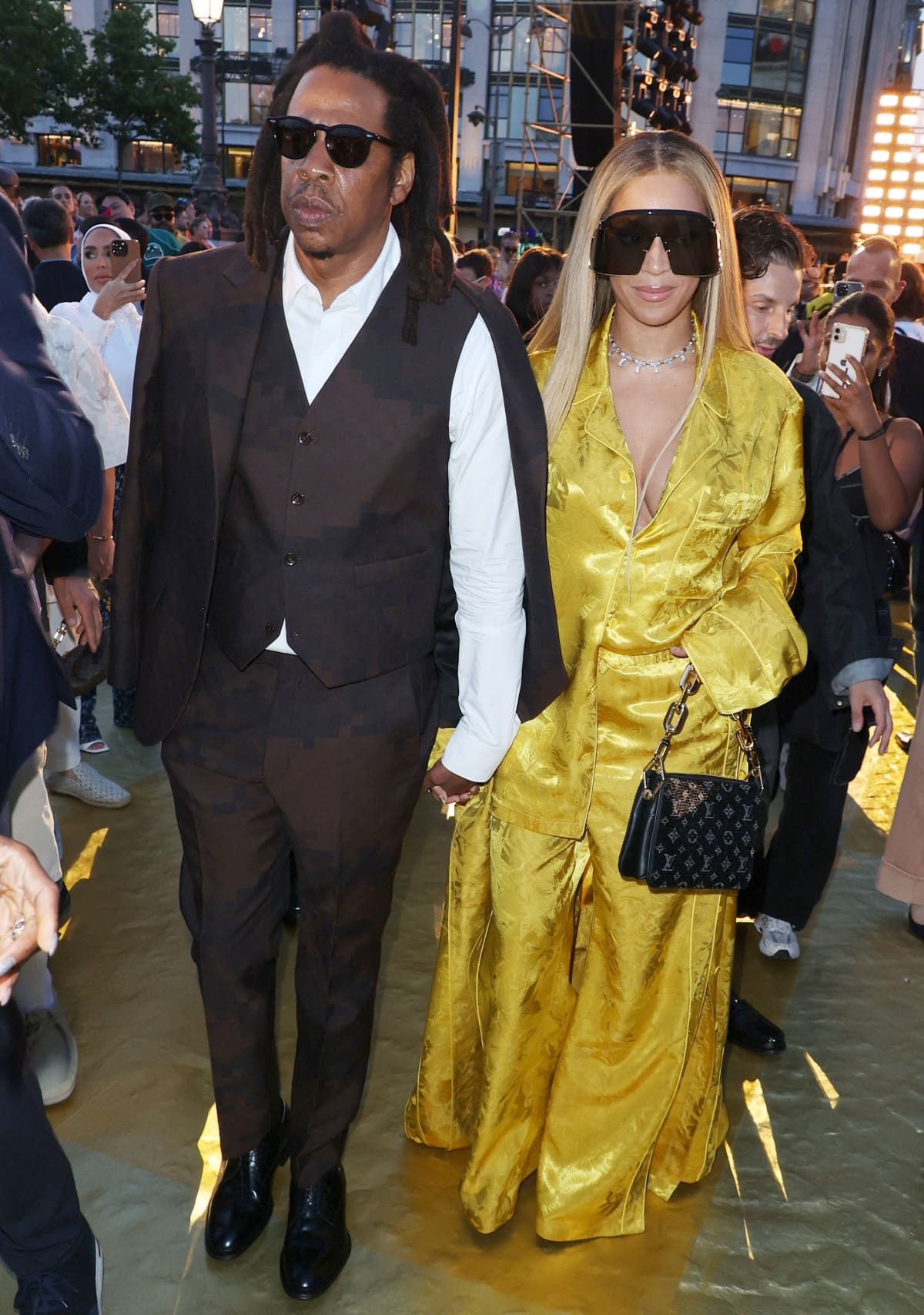 Jay-Z and Beyonce looking every bit the power couple in their custom Louis Vuitton outfits at the Louis Vuitton Menswear Spring/Summer 2024 show during Paris Fashion Week