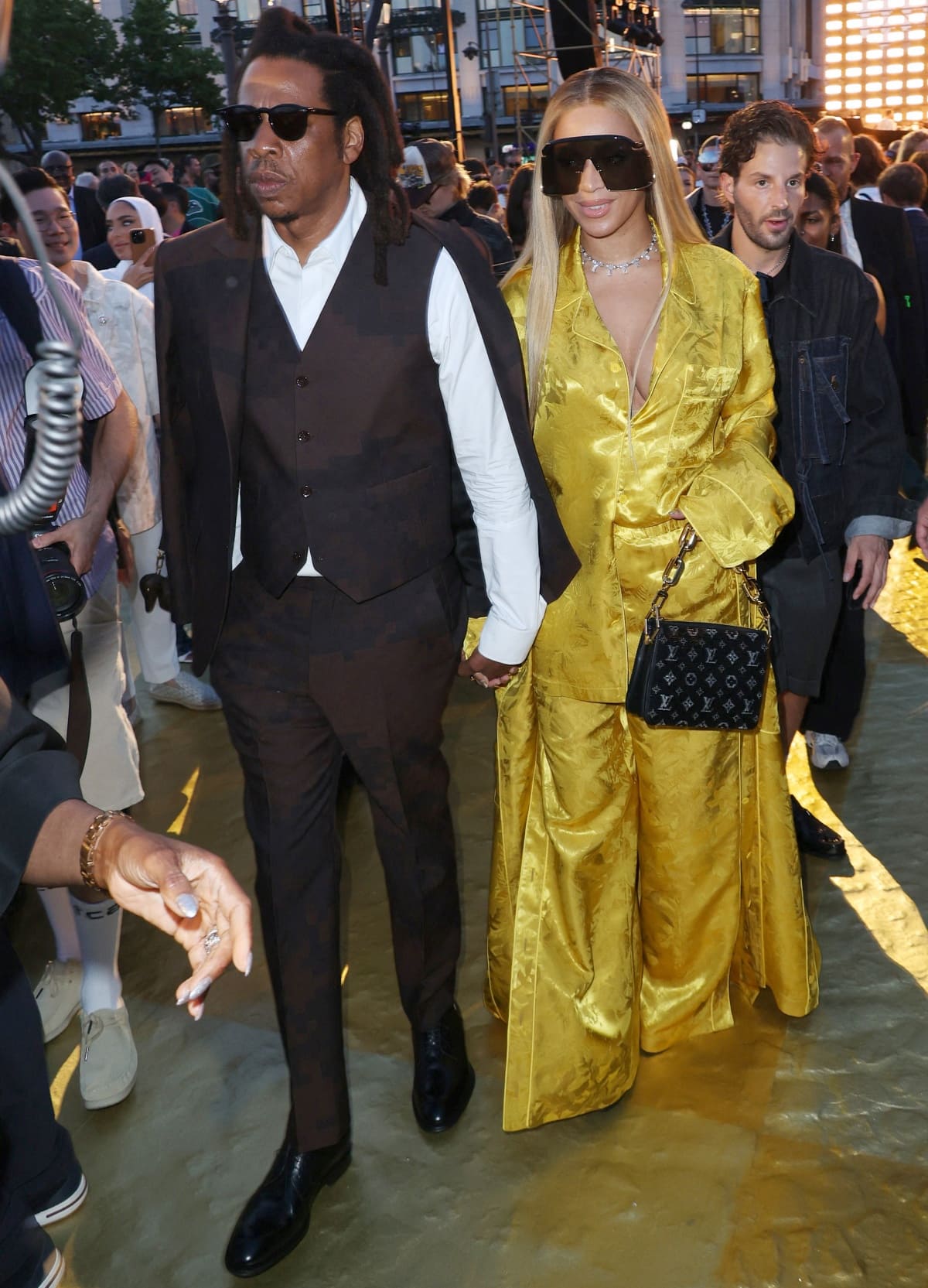 Jay-Z and Beyonce making their way to the front row of Pharrell Williams’ first Louis Vuitton fashion show as a multi-season successor to the late Virgil Abloh