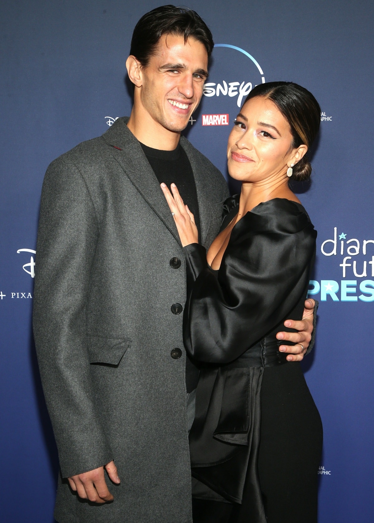 Joe LoCicero and Gina Rodriguez kept close to each other on the red carpet at the premiere of Diary of a Future President