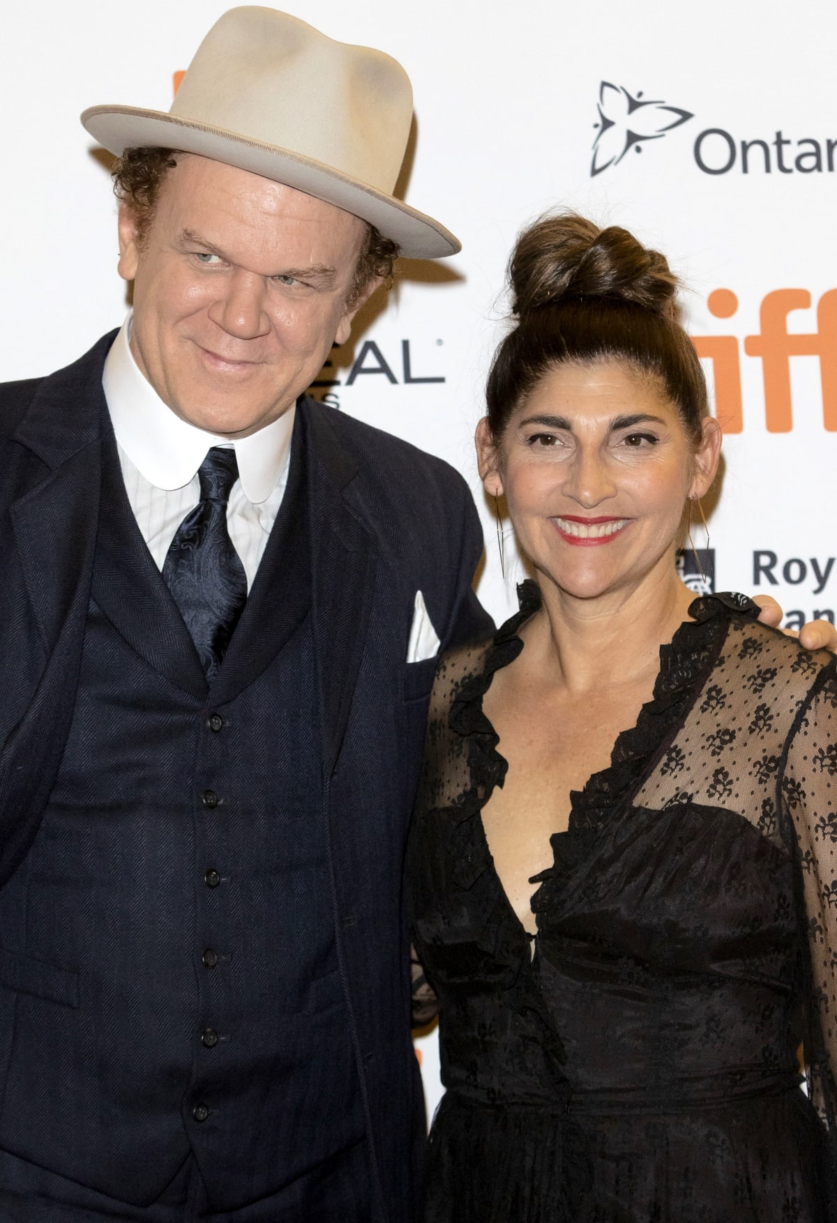 John C. Reilly and Alison Dickey were all smiles at the premiere of The Sisters Brothers during the Toronto Film Festival