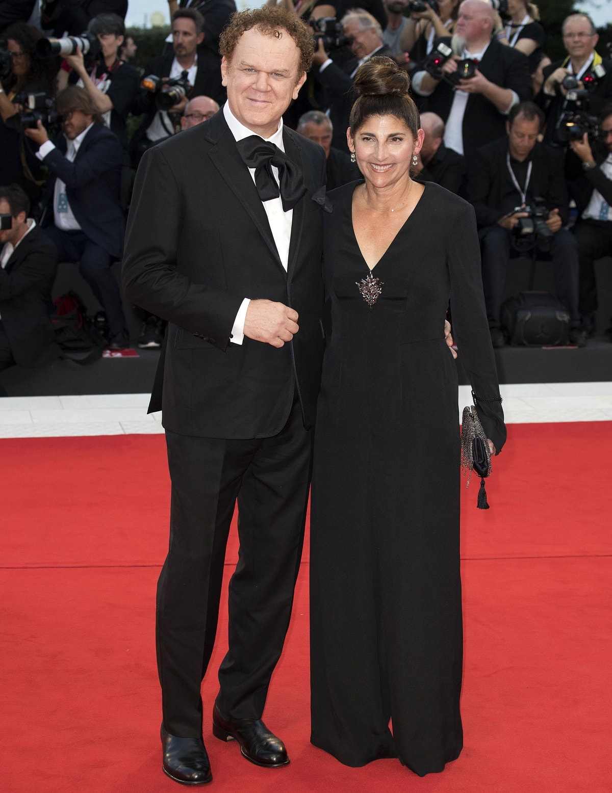 John C. Reilly and Alison Dickey looking elegant at the premiere of The Sisters Brothers during the 75th Venice Film Festival