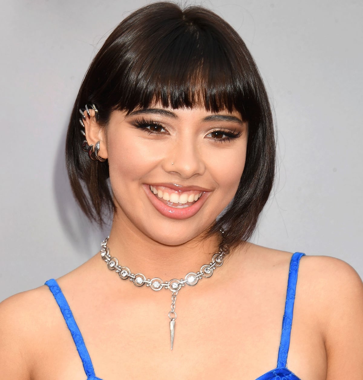 Xochitl Gomez debuting a chic bob with blunt bangs and an asymmetric style for a dose of cool edge
