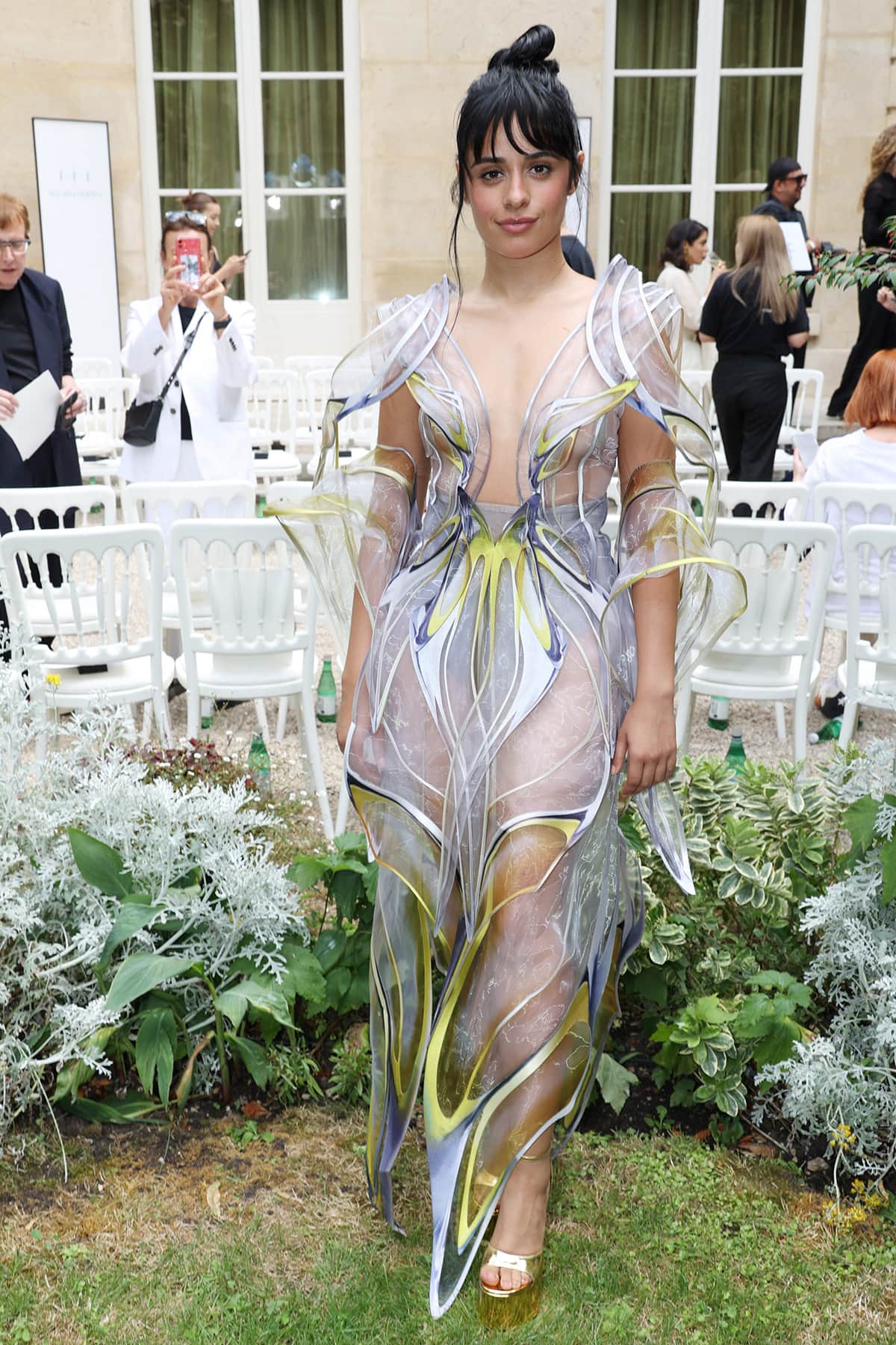 Camila Cabello goes braless underneath a butterfly-inspired sheer gown by Iris Van Herpen during Paris Haute Couture Fashion Week on July 3, 2023