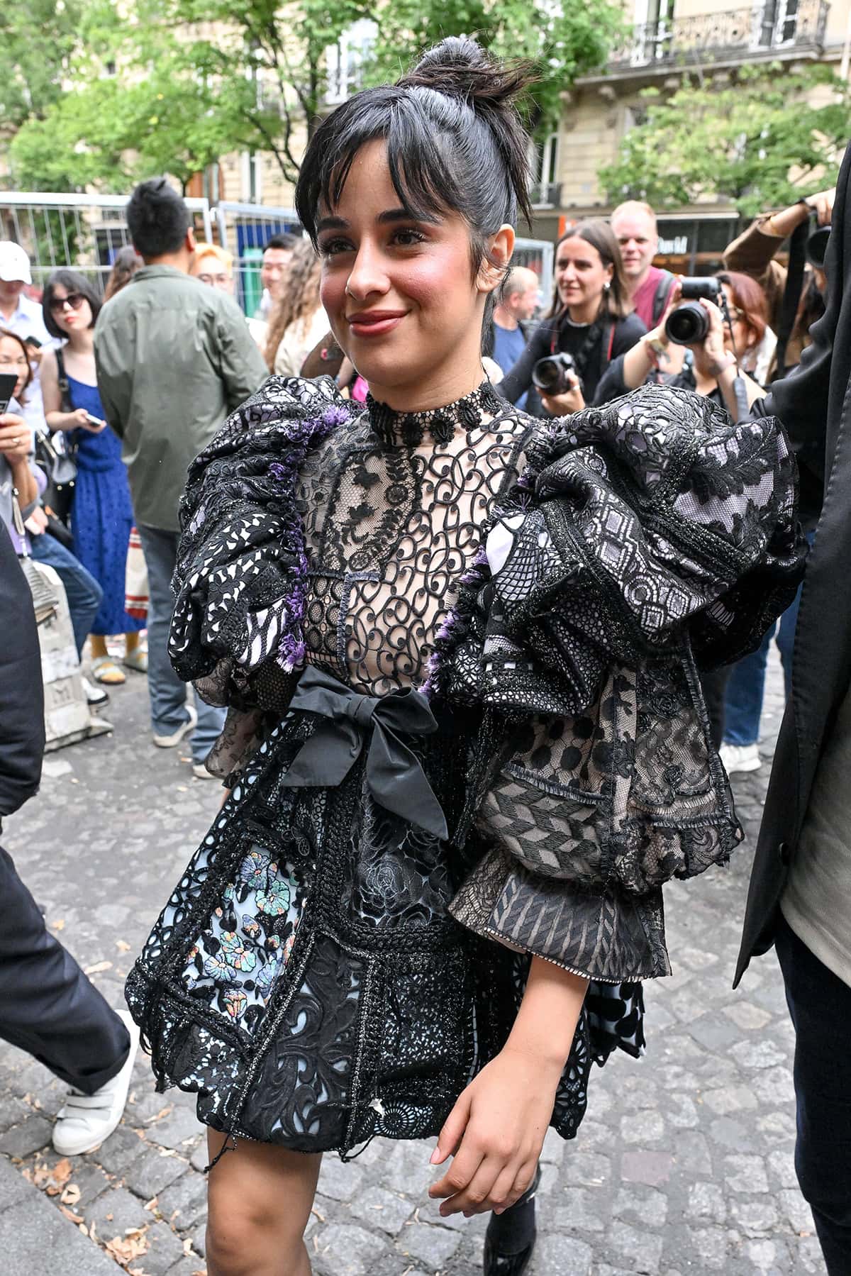 Camila Cabello keeps all the attention to her gothic lace dress by going jewelry-free and pulling her hair up