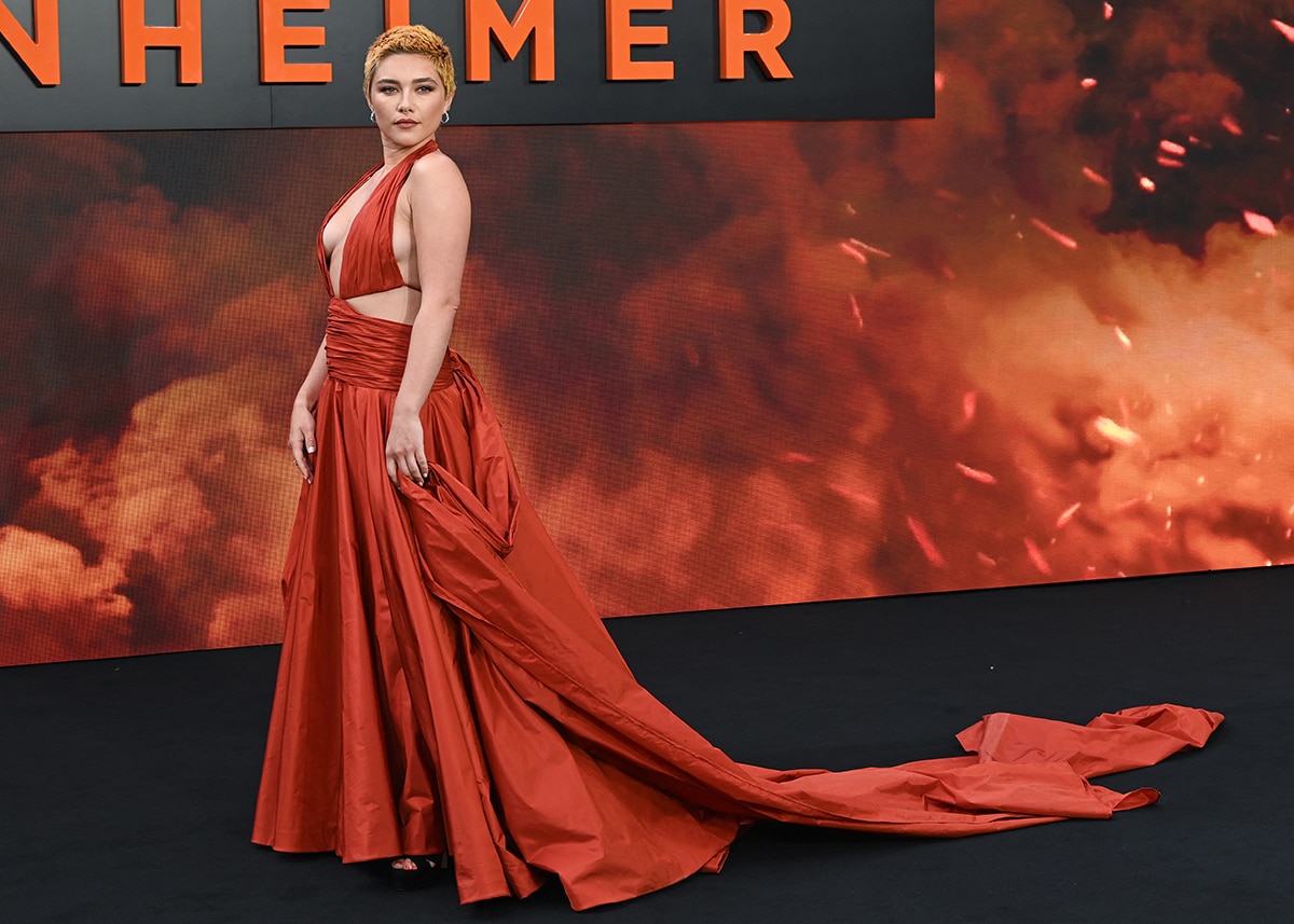 Florence Pugh stands out in a burnt orange Valentino gown at the Oppenheimer London premiere on July 13, 2023