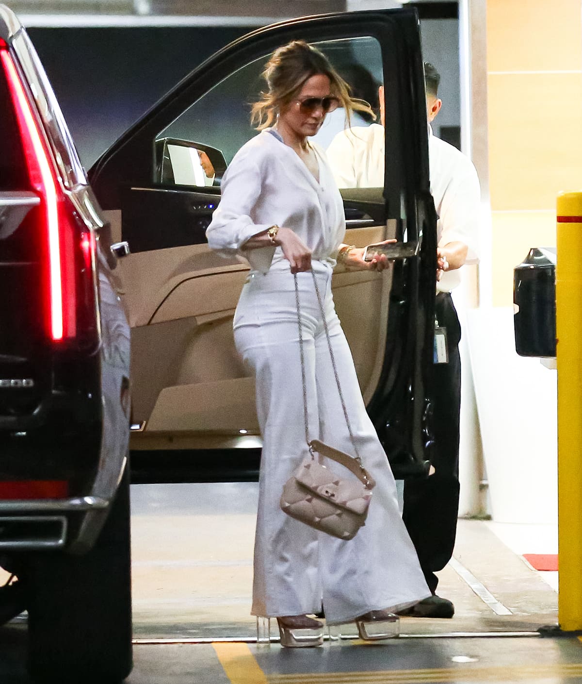 Jennifer Lopez opts for a monochromatic white look at a parking lot in Los Angeles on July 20, 2023